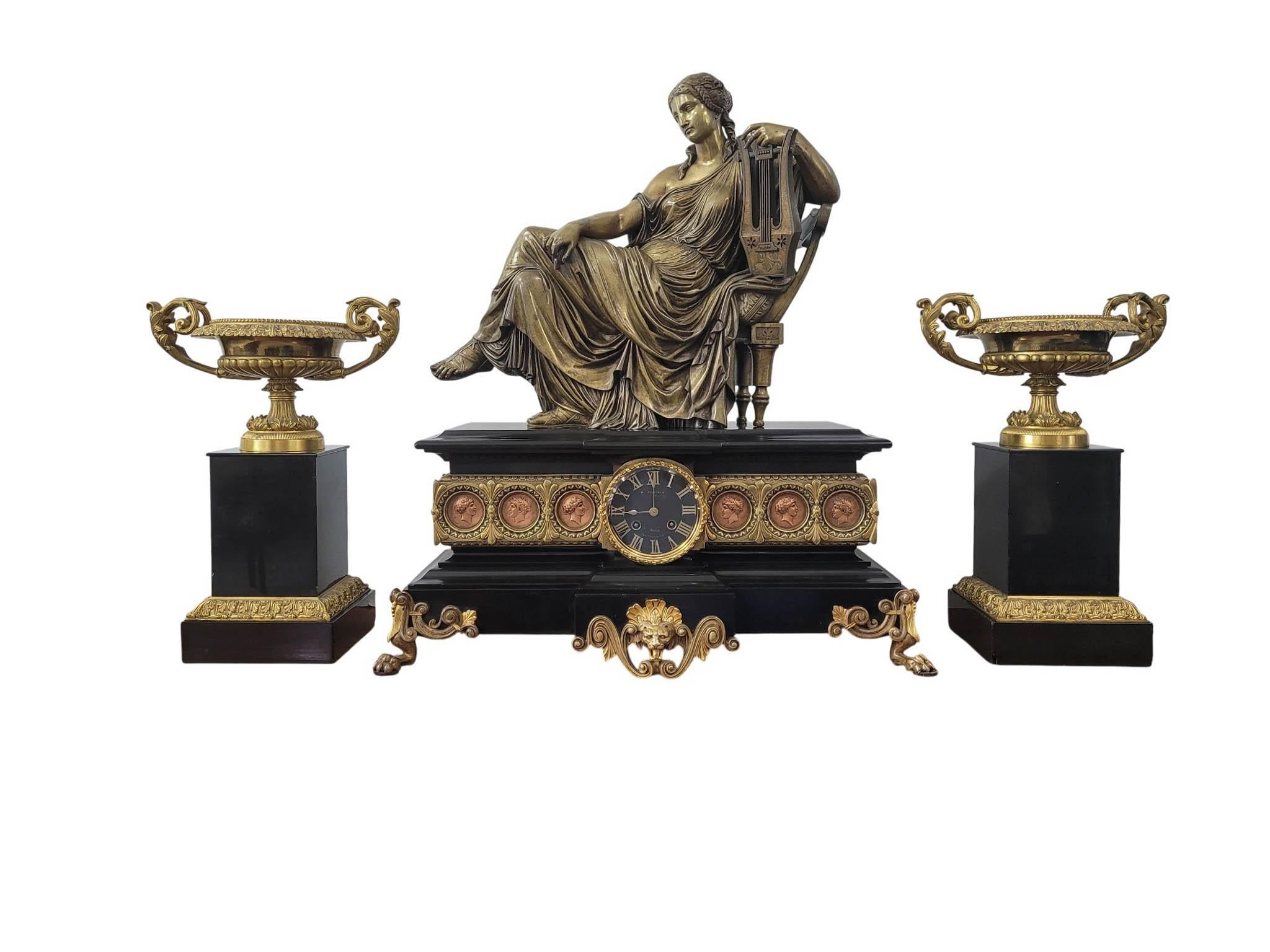 This magnificent three-piece mantel clock garniture exemplifies the height of French Empire Revival design in the 19th century—where classical grandeur, refined materials, and superb craftsmanship converge to create a work of both artistry and
