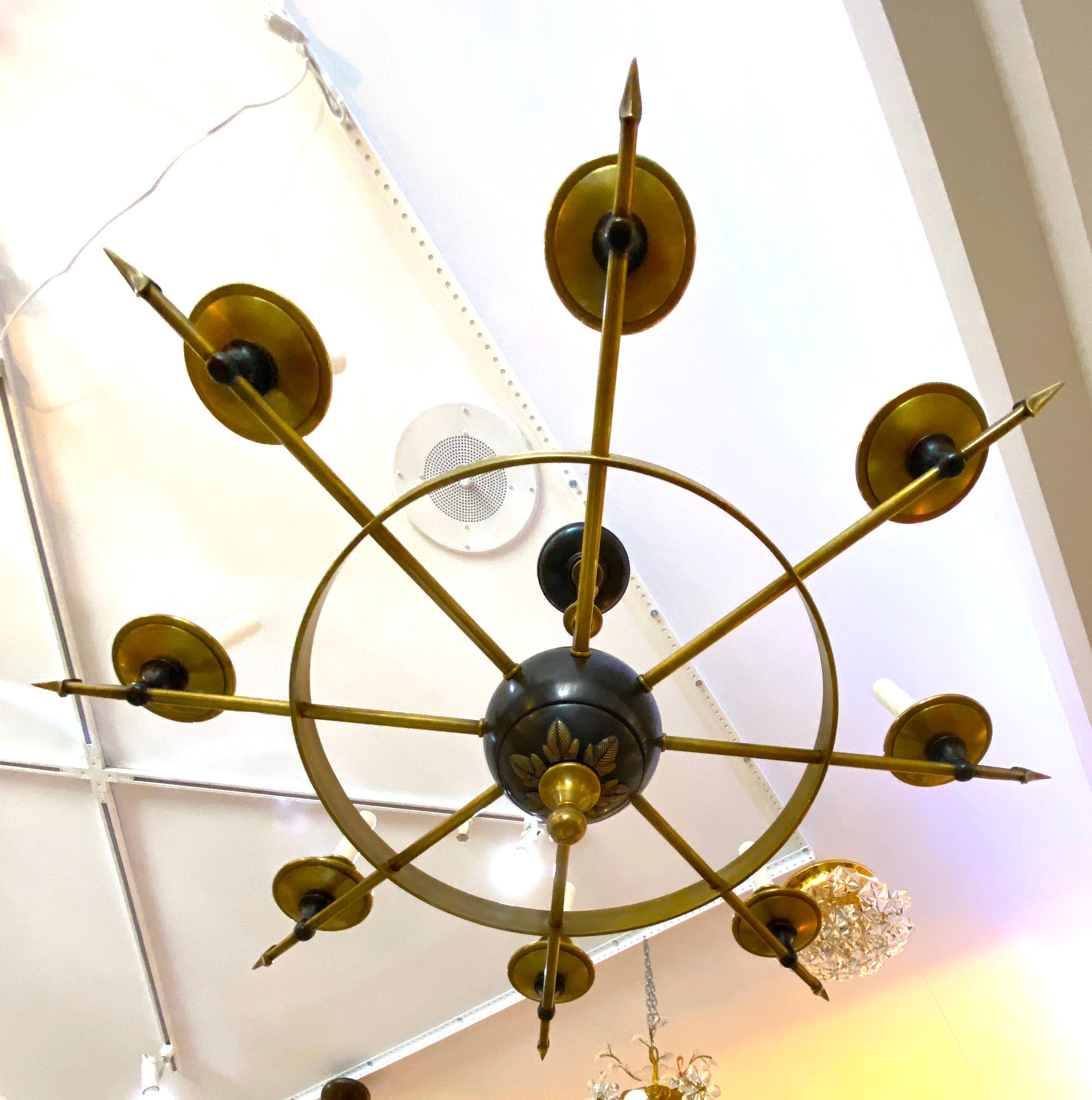 This stylish Empire revival chandelier dates to the late 20th century and is fabricated in brass, with natural and hand-rubbed bronze finish.

Note: Requires eight candleabra based light bulbs.