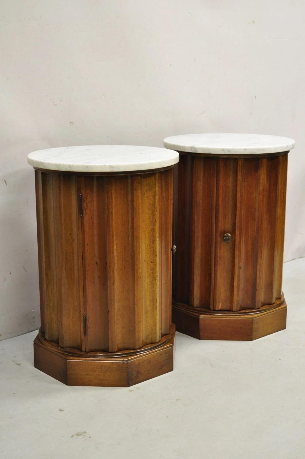 Vintage French Empire Style Round Marble Top Mahogany Reeded Column Form Pedestal Cabinet End Tables - a Pair. Item features single cabinet door, brass door pull, white Italian marble top, great style and form. Circa Mid 20th Century. Measurements: