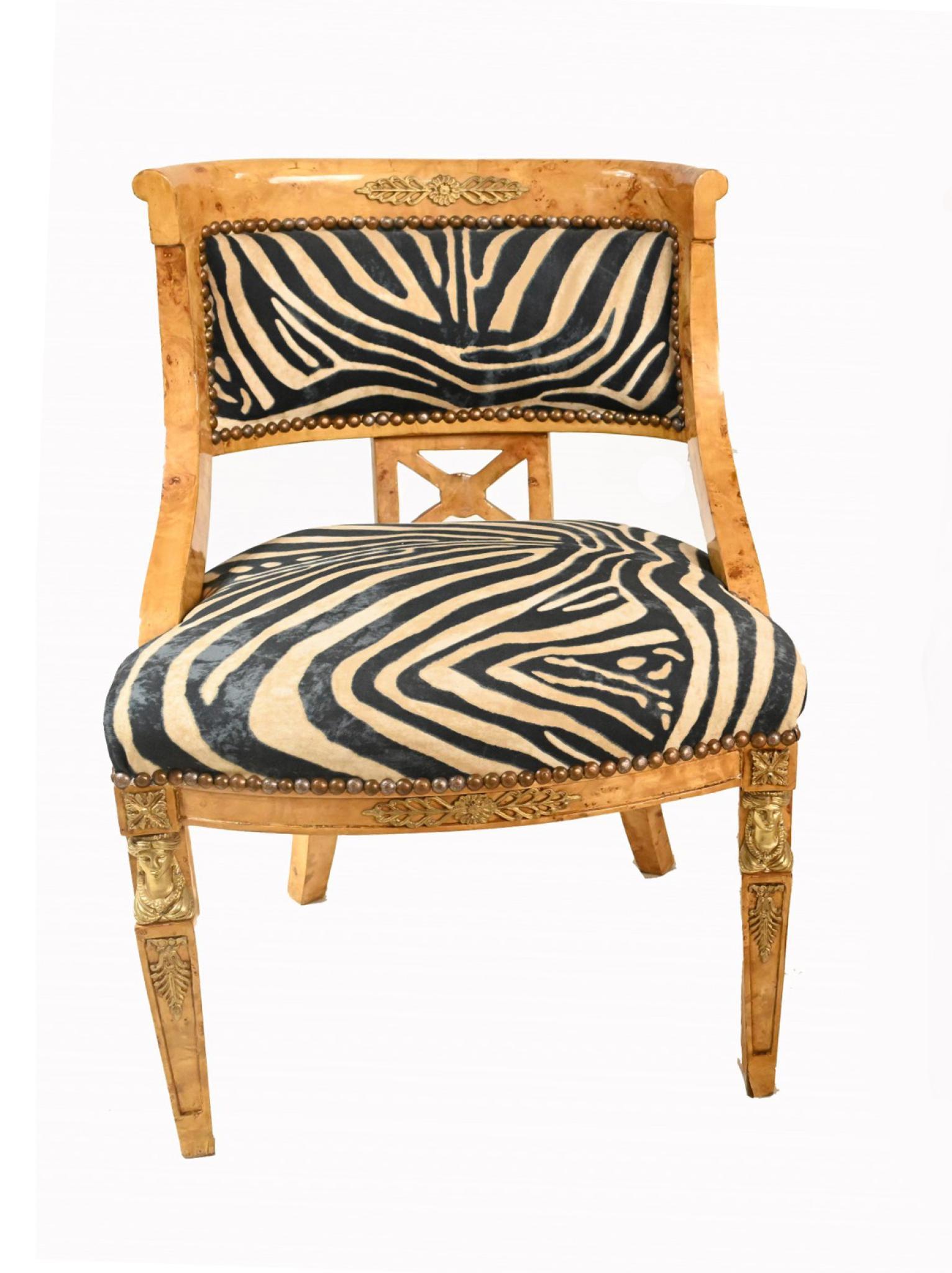 Single satinwood chair in the French Empire manner
Hand crafted from satinwood with ormolu fixtures 
Funky zebra print upholstery on this eye catching pair
Offered in great shape ready for home use right away
We ship to every corner of the planet -