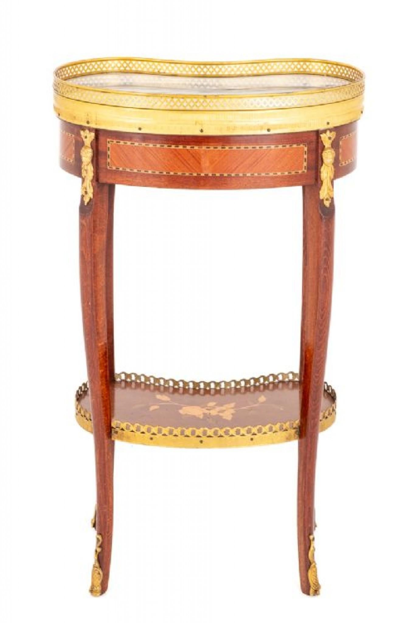 Pretty French Mahogany occasional table in the French Empire manner
circa 1930
This occasional table being of a kidney shaped form.
Standing upon swept legs with ormolu toes and ormolu mounts to the tops of the legs.
The lower shaped tray