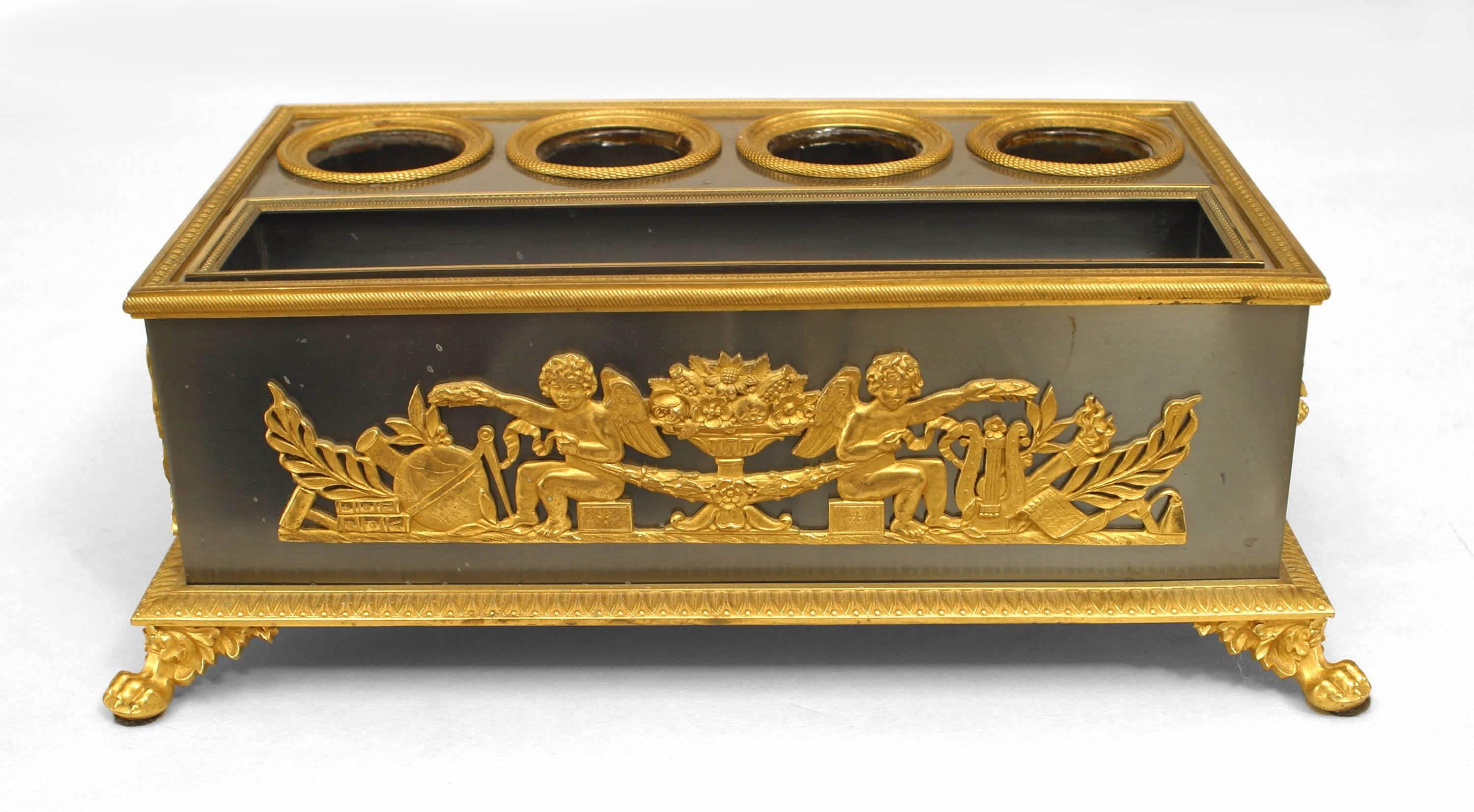French Empire (19th Century) steel inkwell with gilt bronze trim with four original glass inserts and a side drawer.
