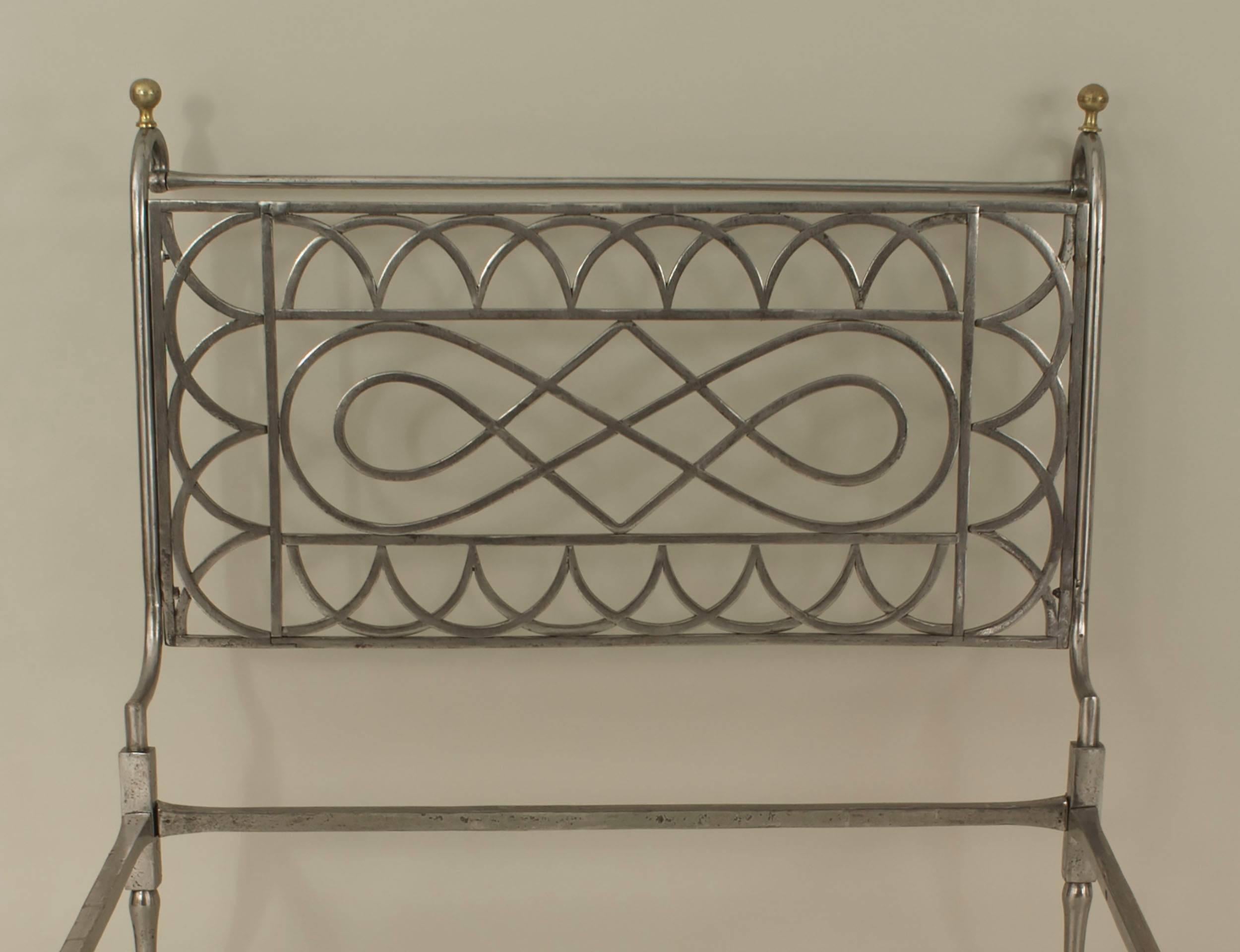 French Empire-style (19/20th Century) steel and brass trimmed daybed with open arch and scroll design sides
