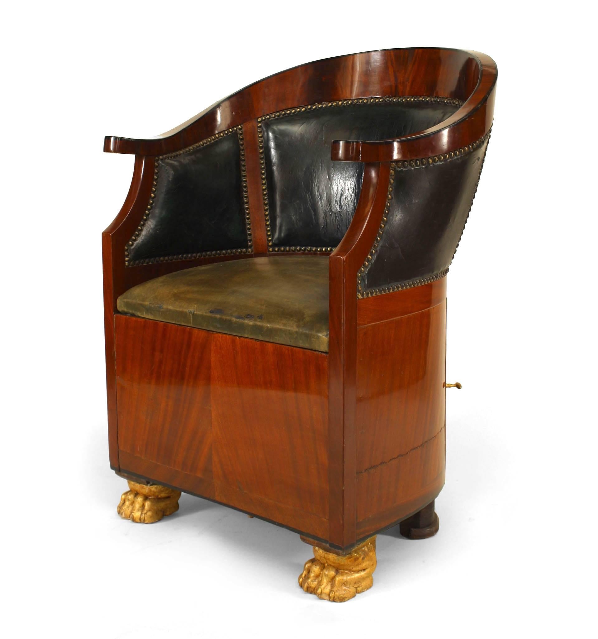 French Empire-style (19th Century) leather round back bergere arm chair with commode base.
