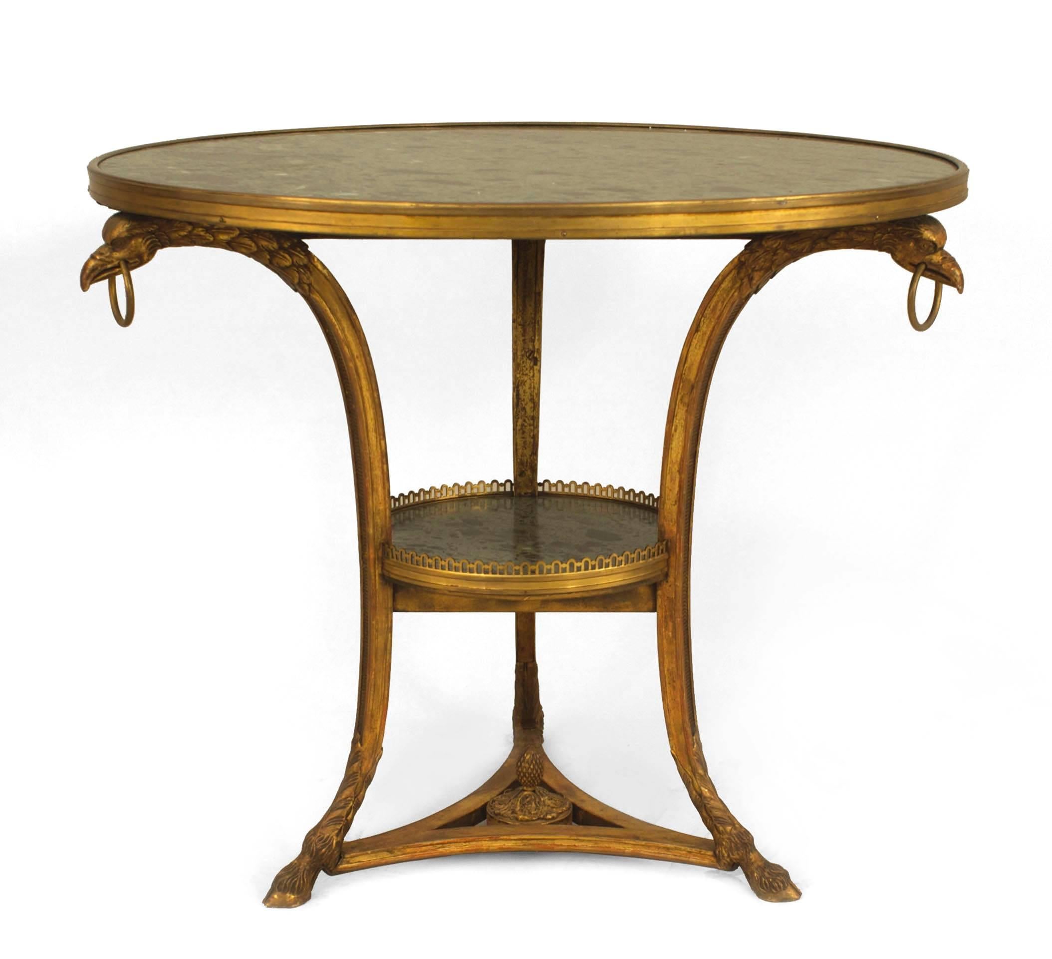 French Empire-style (19th Century) round gueridon table with 3 legged gilt wood bird head legs and green marble top and shelf.
