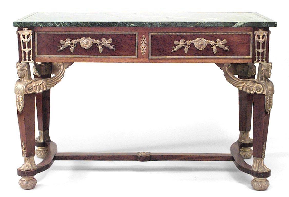 French Empire style (19th Century) mahogany and bronze trimmed 2 drawer table desk with stretcher, griffins, and green marble top.
