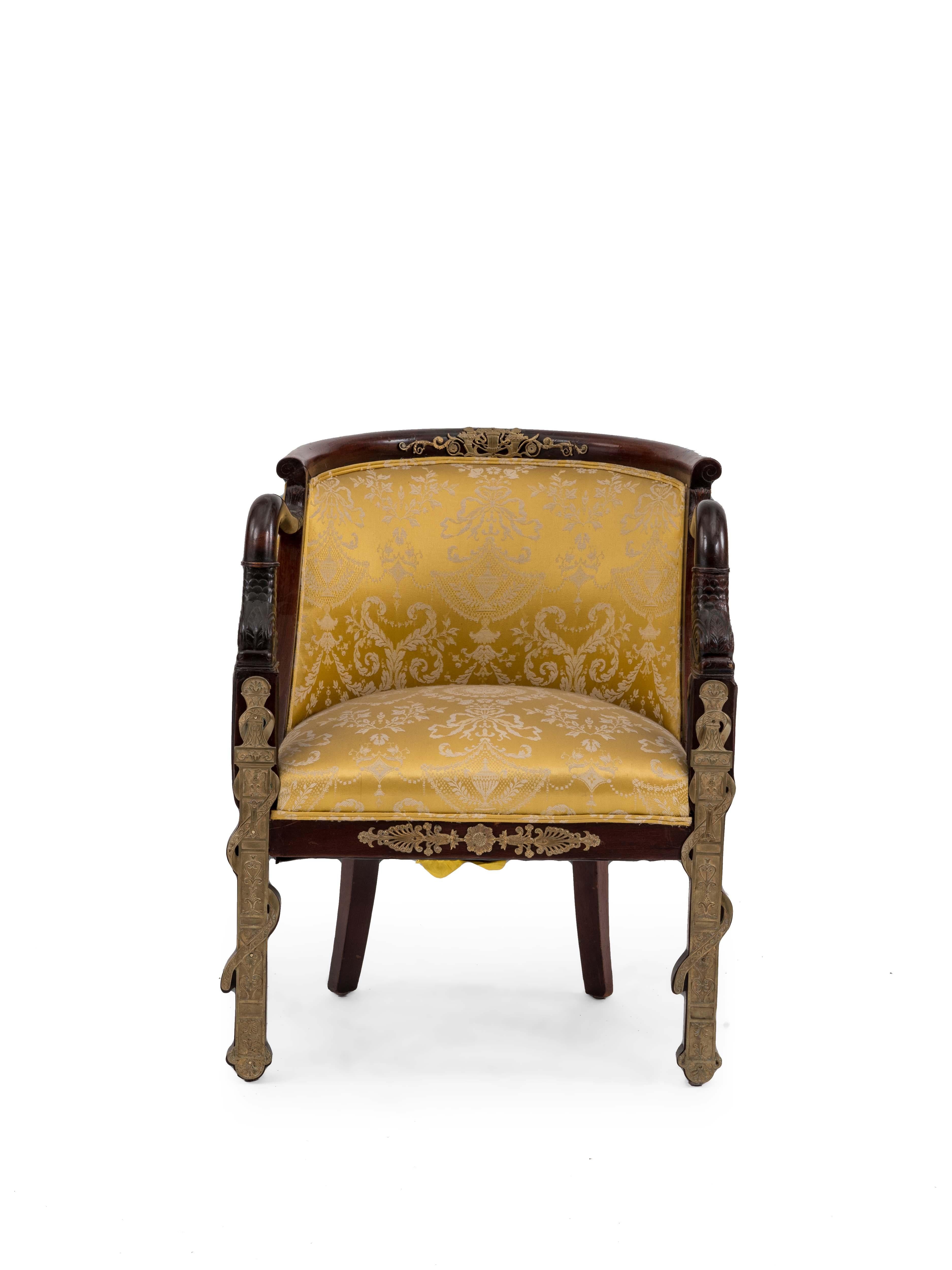 French Empire style (19th Cent) mahogany round back dolphin arm chair with bronze trim and gold upholstery
