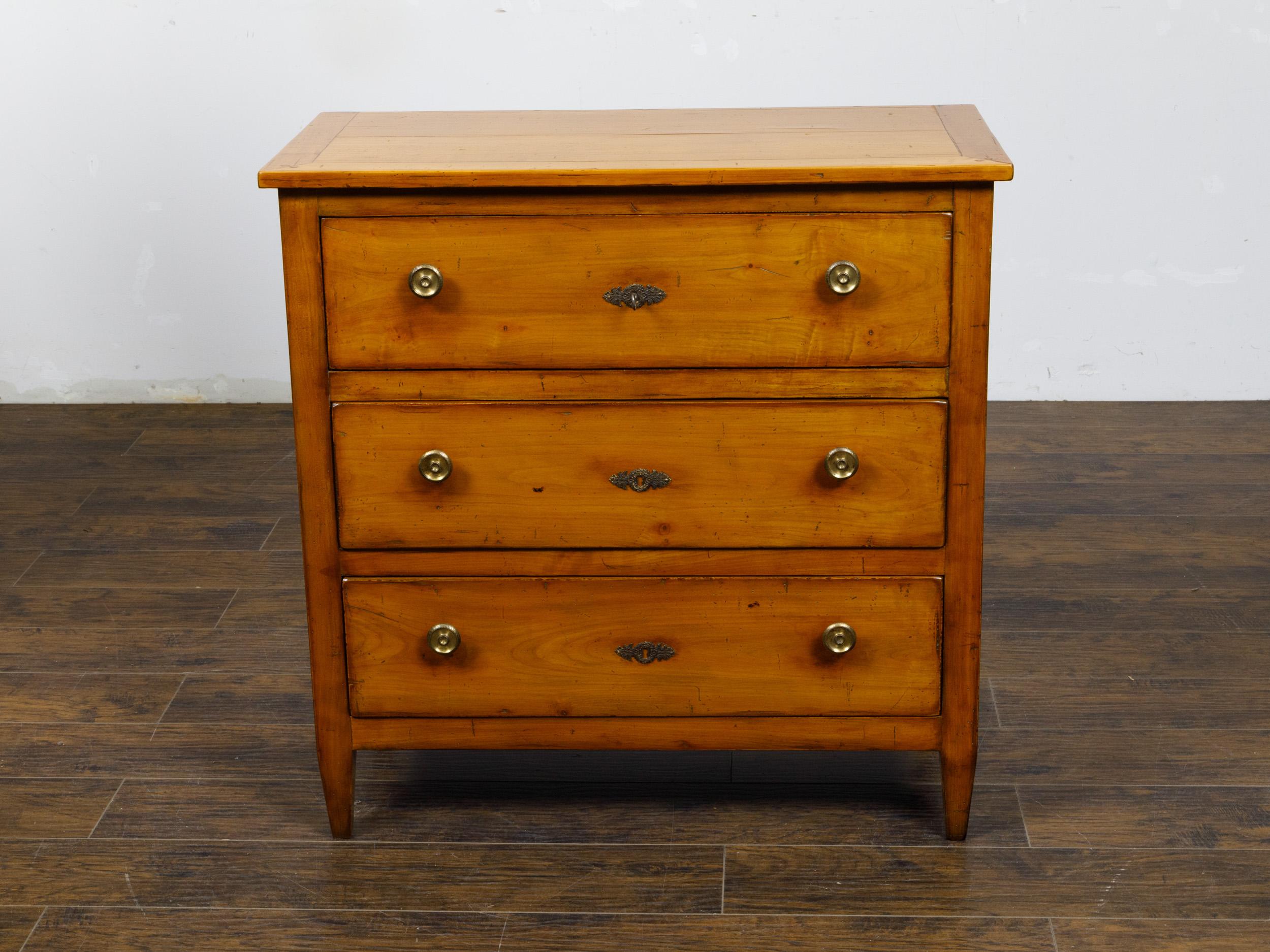 A French Empire style walnut chest from the 19th century with drop front desk and two additional drawers. This elegant French Empire style walnut chest from the 19th century exudes classical refinement with its multi-functional design. It features a