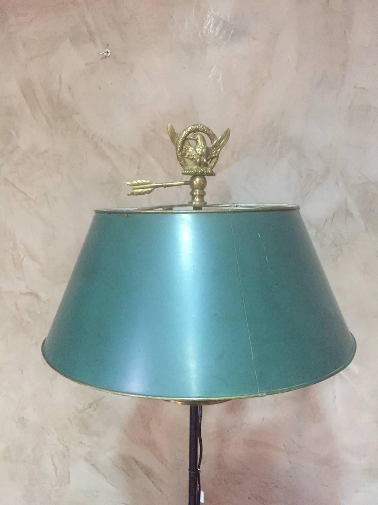 French Empire style bronze and metal floor lamp. The shade is painted sheet metal.
There is an bronze eagle at the top. Three lights.
