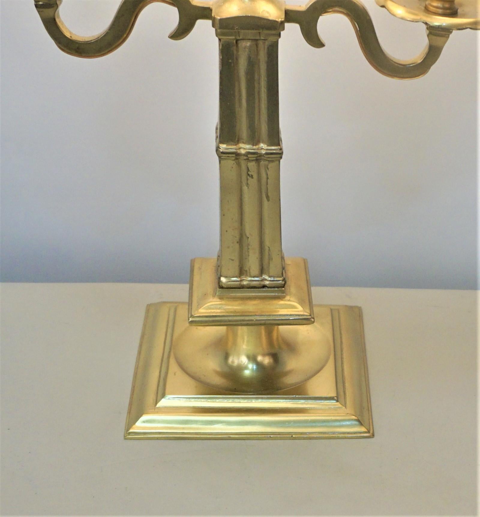 Double arm French bronze table lamp with painted metal shade.