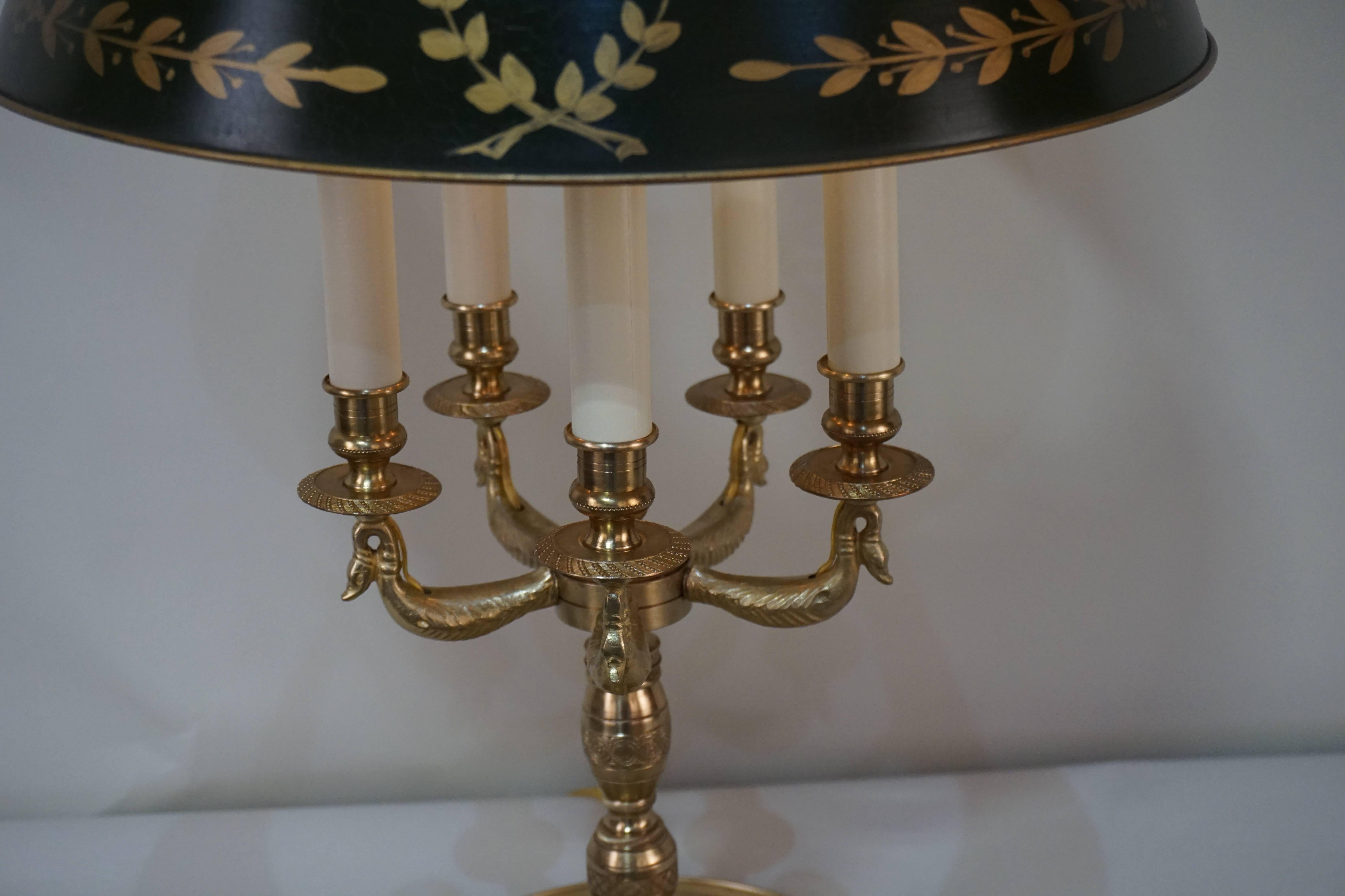 An empire style five light French bouillotte table lamp with adjustable height shade. 
Shade is dark green/amber color.