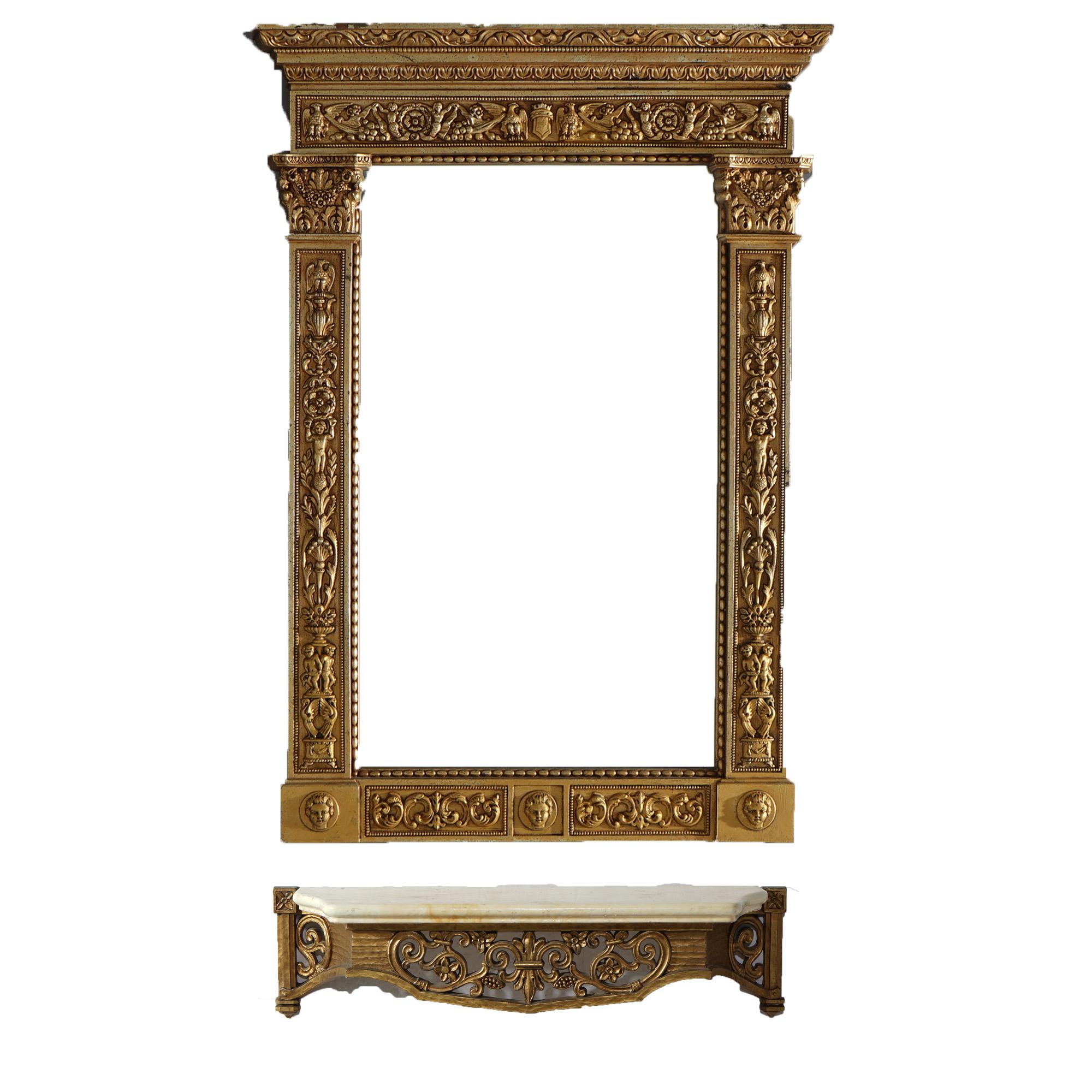 A French Empire mirror and shelf offers gold gilt frame with eagles, mermaids (caryatids), masks, flowers and scroll elements over marble top gilt shelf, c1950

Measures - mirror 34.5