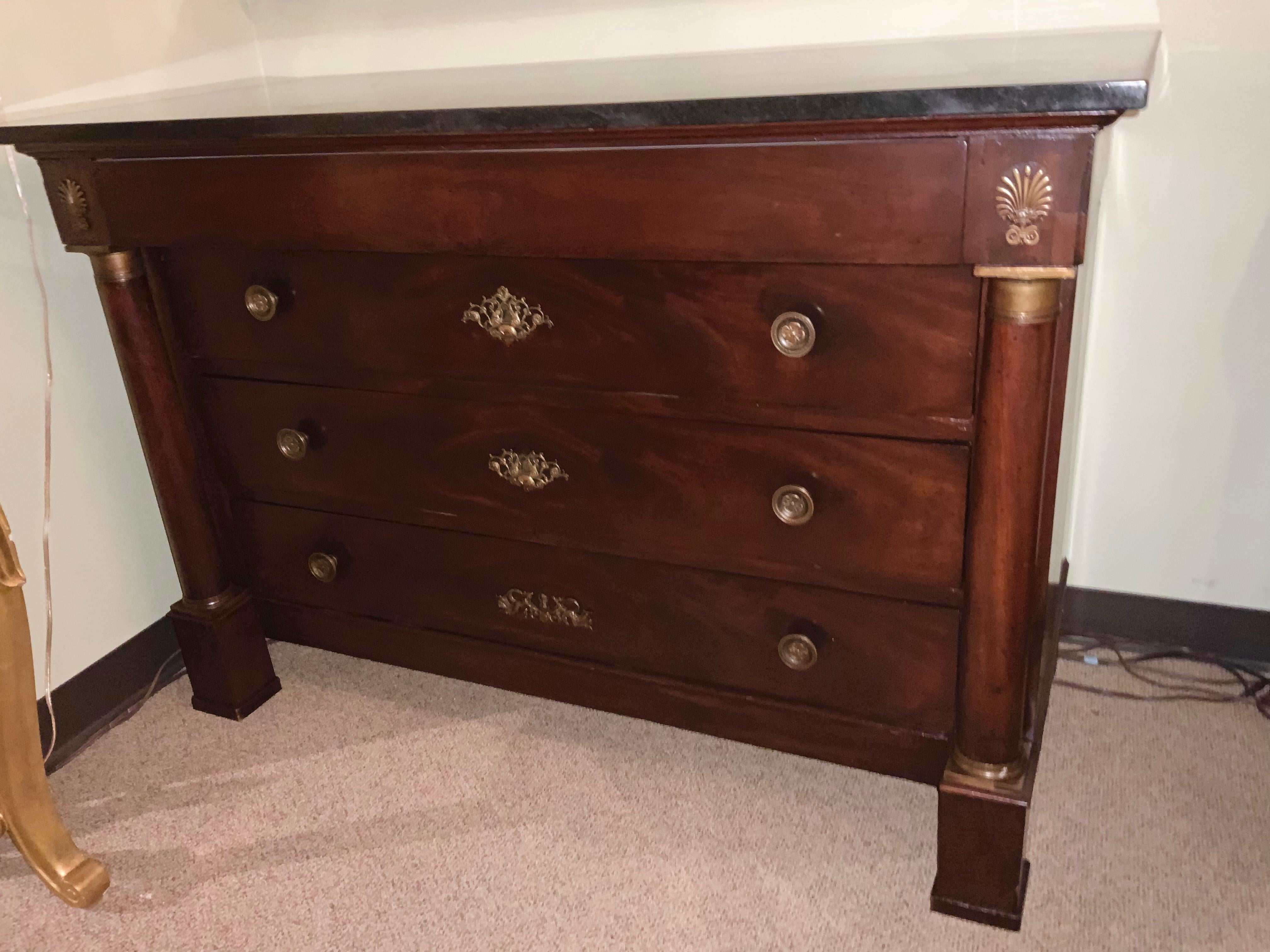 This is a handsome chest of drawers having four drawers that
Draw easily. A column flanks each side and is accented with
Original bronze dore mounts. The drawers are dove tailed and
The construction is very good. A squared foot is evident.
