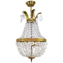 French Empire Style Crystal and Bronze Four-Light Basket - Shaped Chandelier