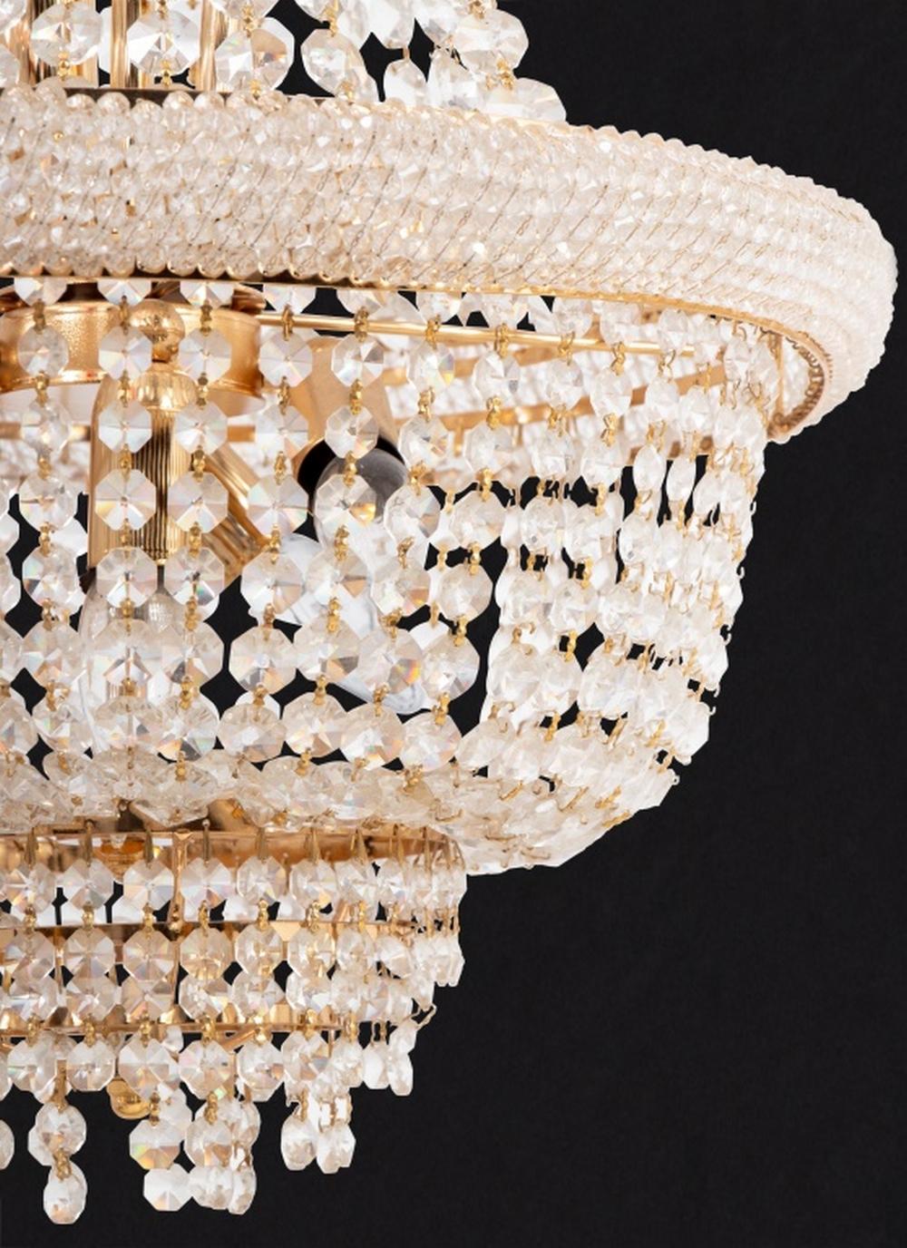 French Empire Style Crystal and Gilt Metal Basket Chandelier, 20th century, top of tiers lined with small faceted beads, each dangling chains of larger faceted crystal beads. 28