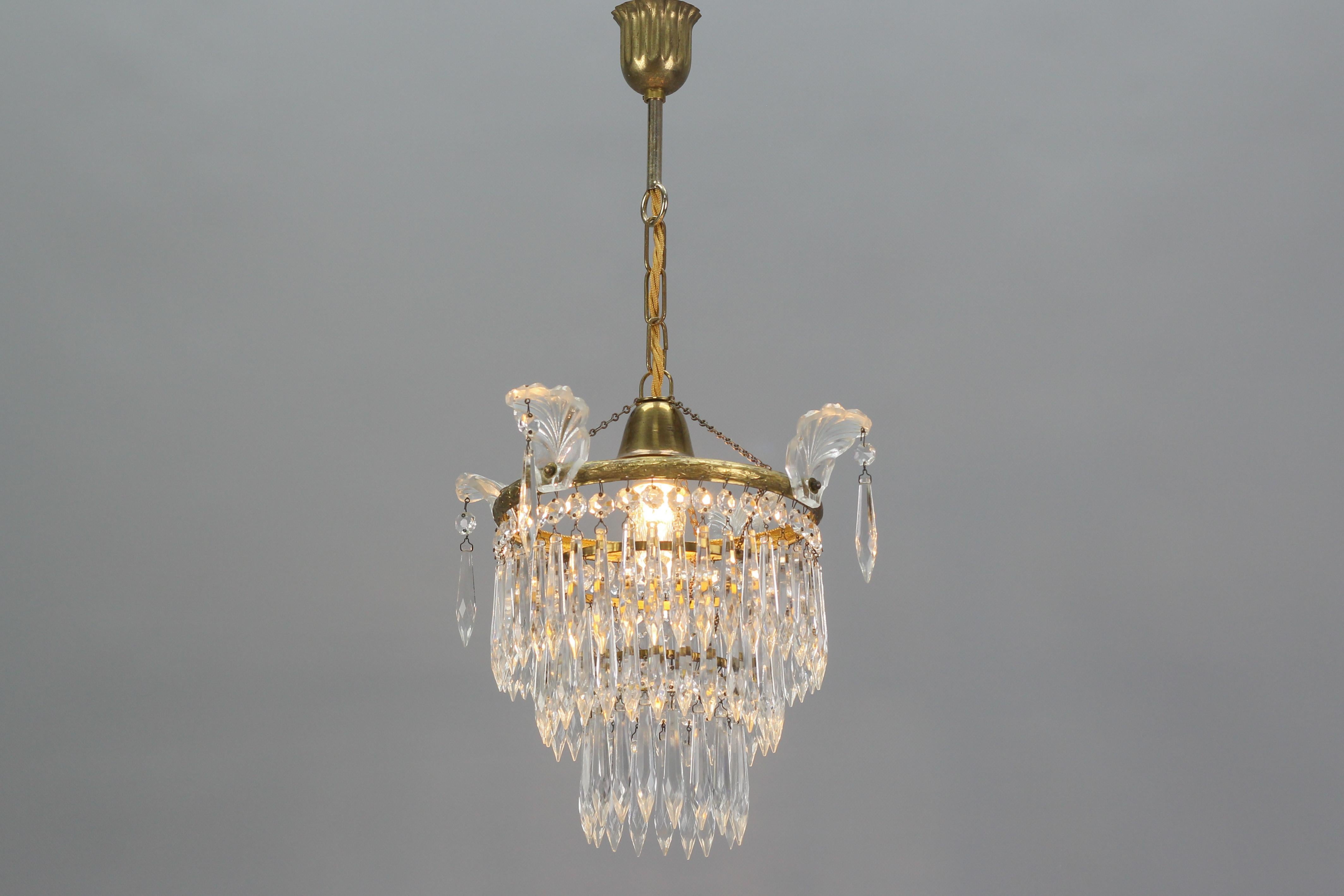 Mid-20th Century French Empire Style Crystal Glass and Brass Three-Tired Chandelier, 1930s For Sale