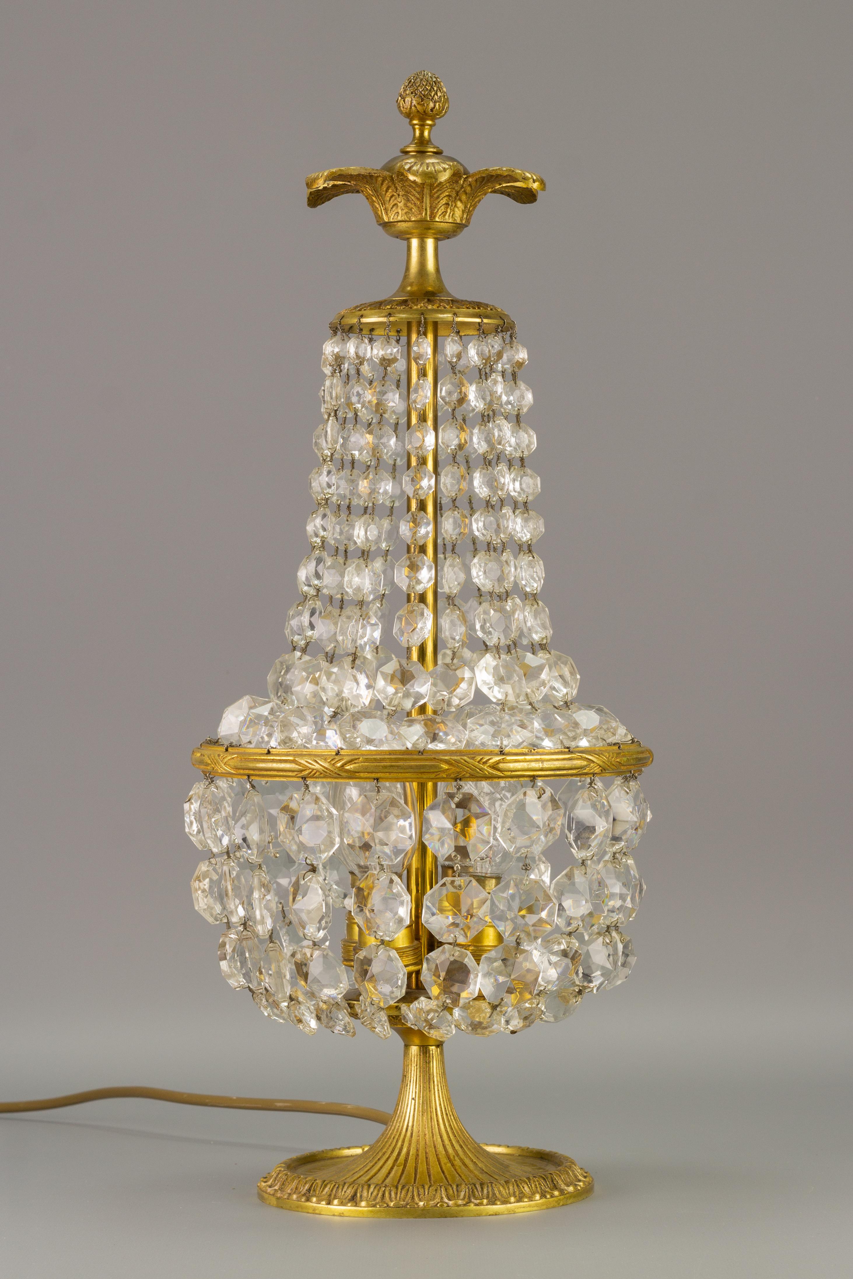 Beautiful Empire-style crystal glass and bronze basket table lamp. 
Four interior lights with E14 size light bulb sockets. France, 1950’s. 
To the US will be shipped with an adapter for the US wiring system.
Measures: Height: 47 cm / 18.5 in; width: