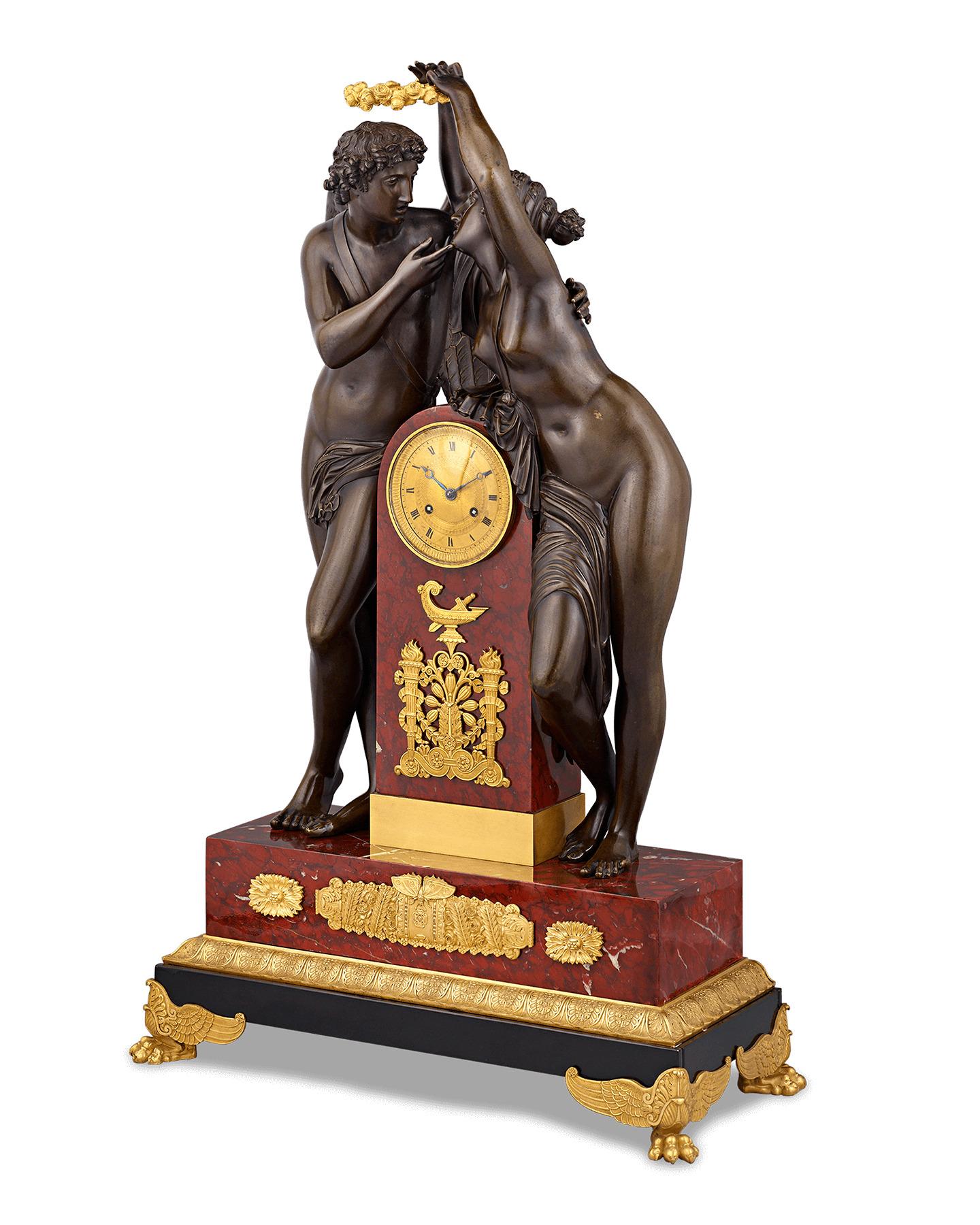 This exceptional French Empire-style mantel clock was created after a model by the famed French sculptor Claude Michallon. The gilt and patinated bronze design captures one of the most legendary love stories in history — the mythological tale of