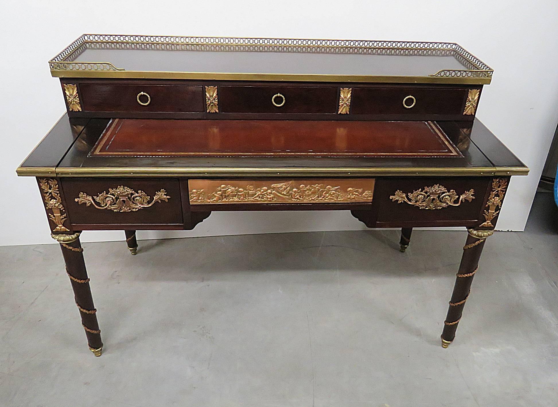 French Empire style desk with five drawers, brass gallery and decor. Measures: 28