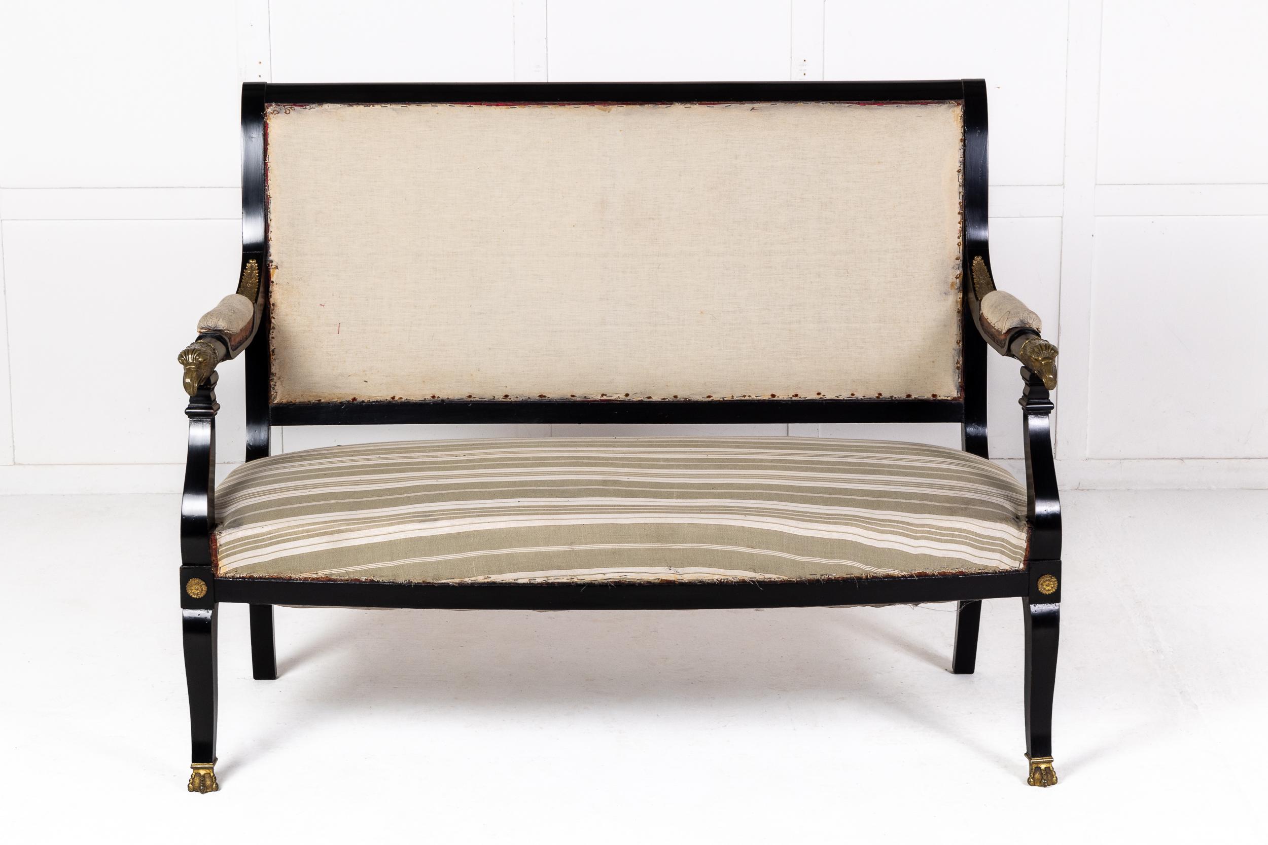 A French Empire Style Ebonised Sofa with Fine Eagle Head Mounts.

This fine sofa, in the early 19th century Empire style, was made in France c.1910. The ebonised finish contrasts beautifully with the fine ormolu mounts, including acanthus leaf