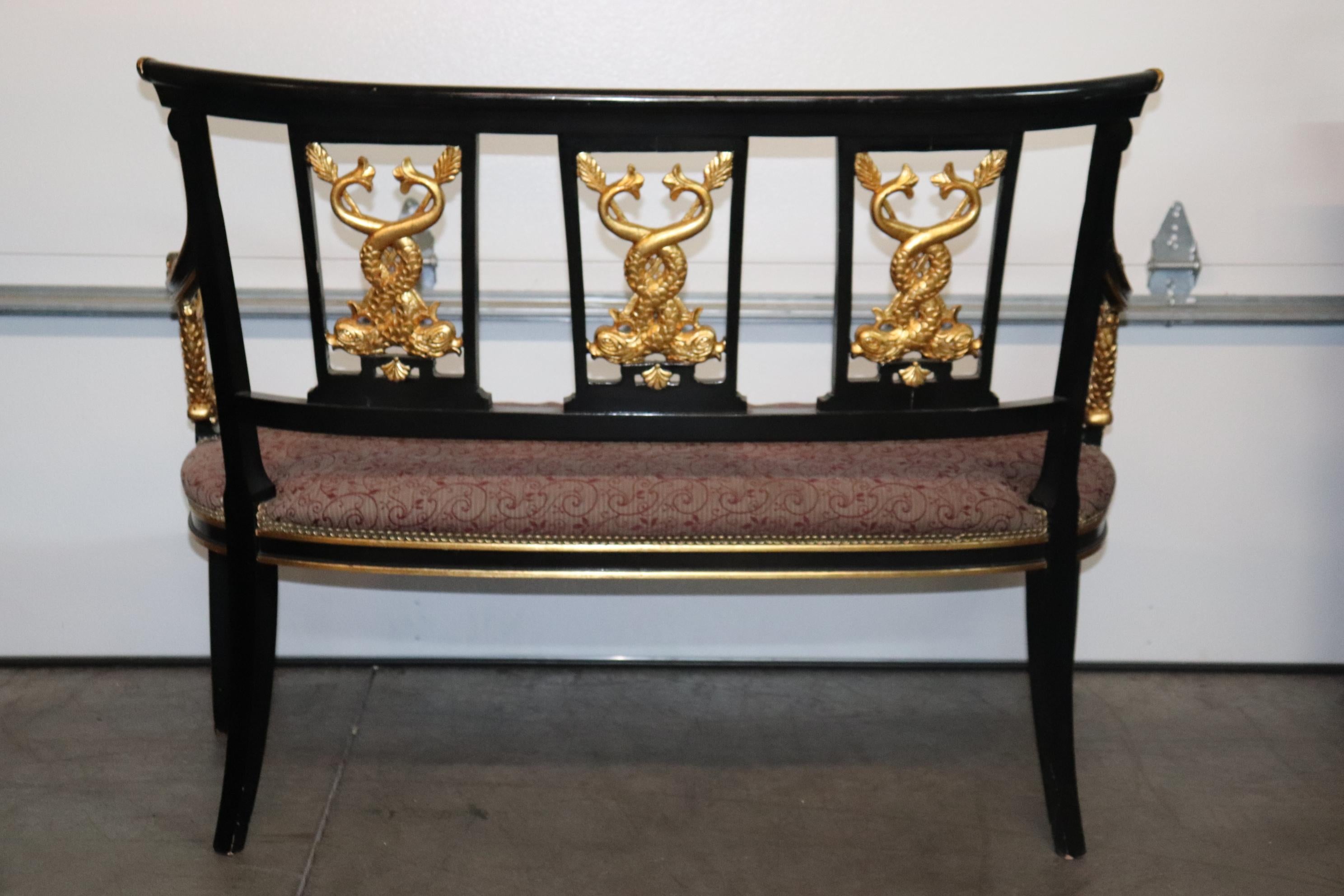 Mid-20th Century French Empire Style Ebonized Giltwood Carved Dolphins Settee Circa 1950 For Sale