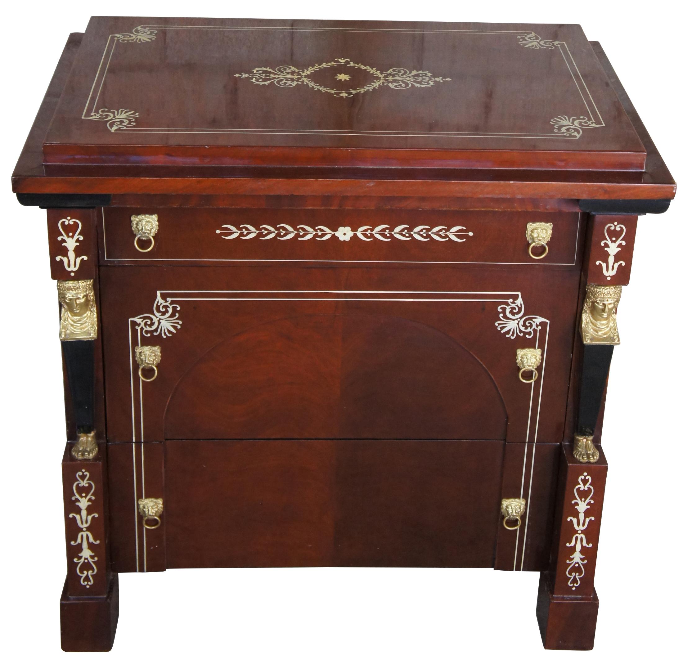 French Empire style Egyptian revival 3 drawer chest side table nightstand Art Deco

20th century Egyptian Revival three drawer chest. Made from mahogany with figural mounts and lion knocker drawer pulls. Features a blend of French and Art Deco