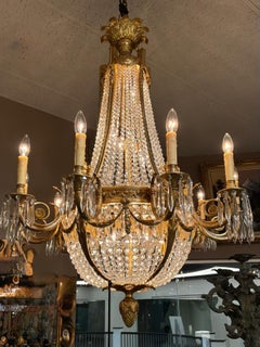 French Empire style fifteen light bronze dore chandelier