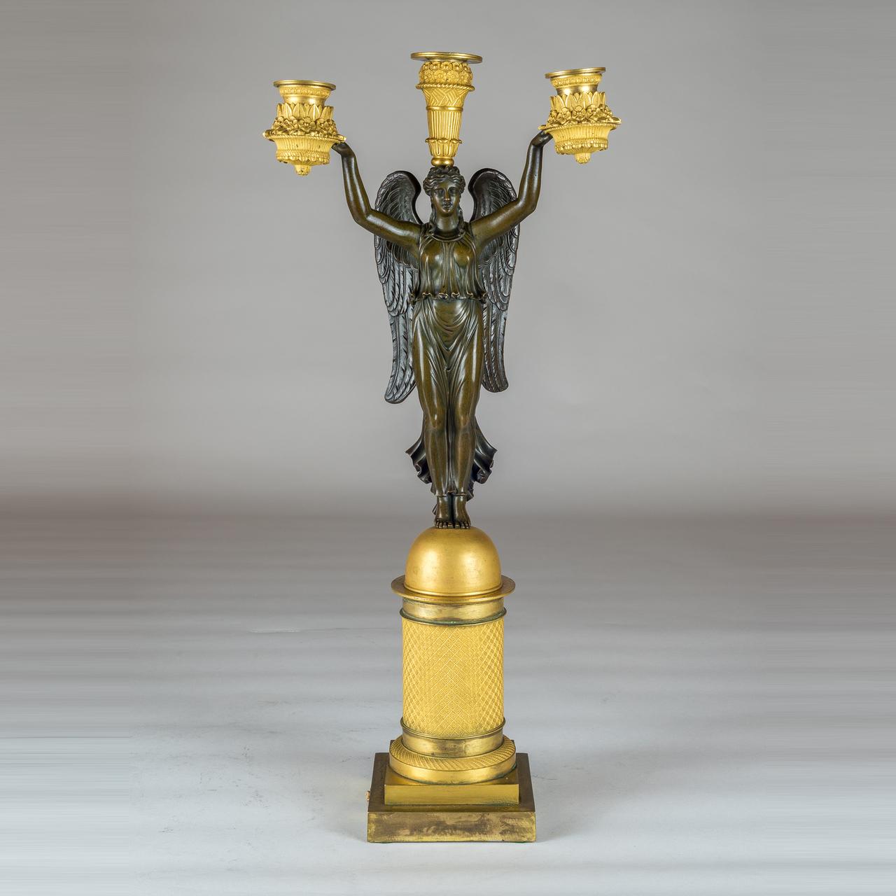 French Empire Style Gilt and Patinated Bronze Three-light Figural Candelabra In Good Condition For Sale In New York, NY