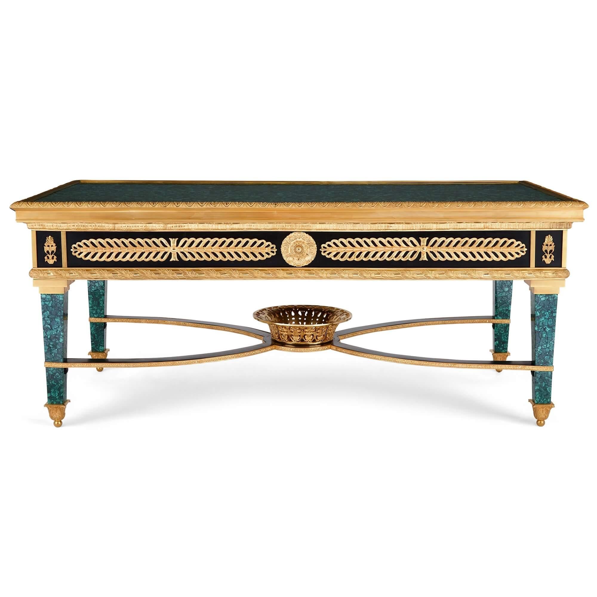 French Empire-style gilt bronze mounted malachite coffee table
French, Early 20th Century
Height 52cm, width 123cm, depth 63cm

Exemplifying all that is grand and regal about the fantastic French Empire-style, this superb piece is expertly crafted