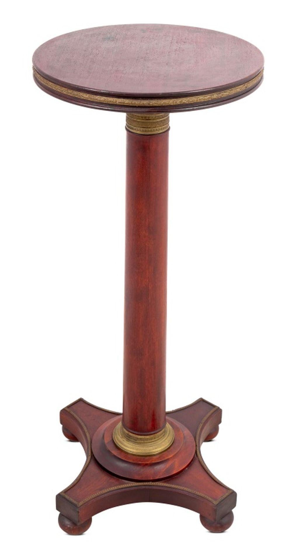 French Empire Style Gilt Metal Mounted Mahogany Pedestal, early 20th century,  the circular top on a tapering column on a quadripartite plinth and ball feet.

35.5