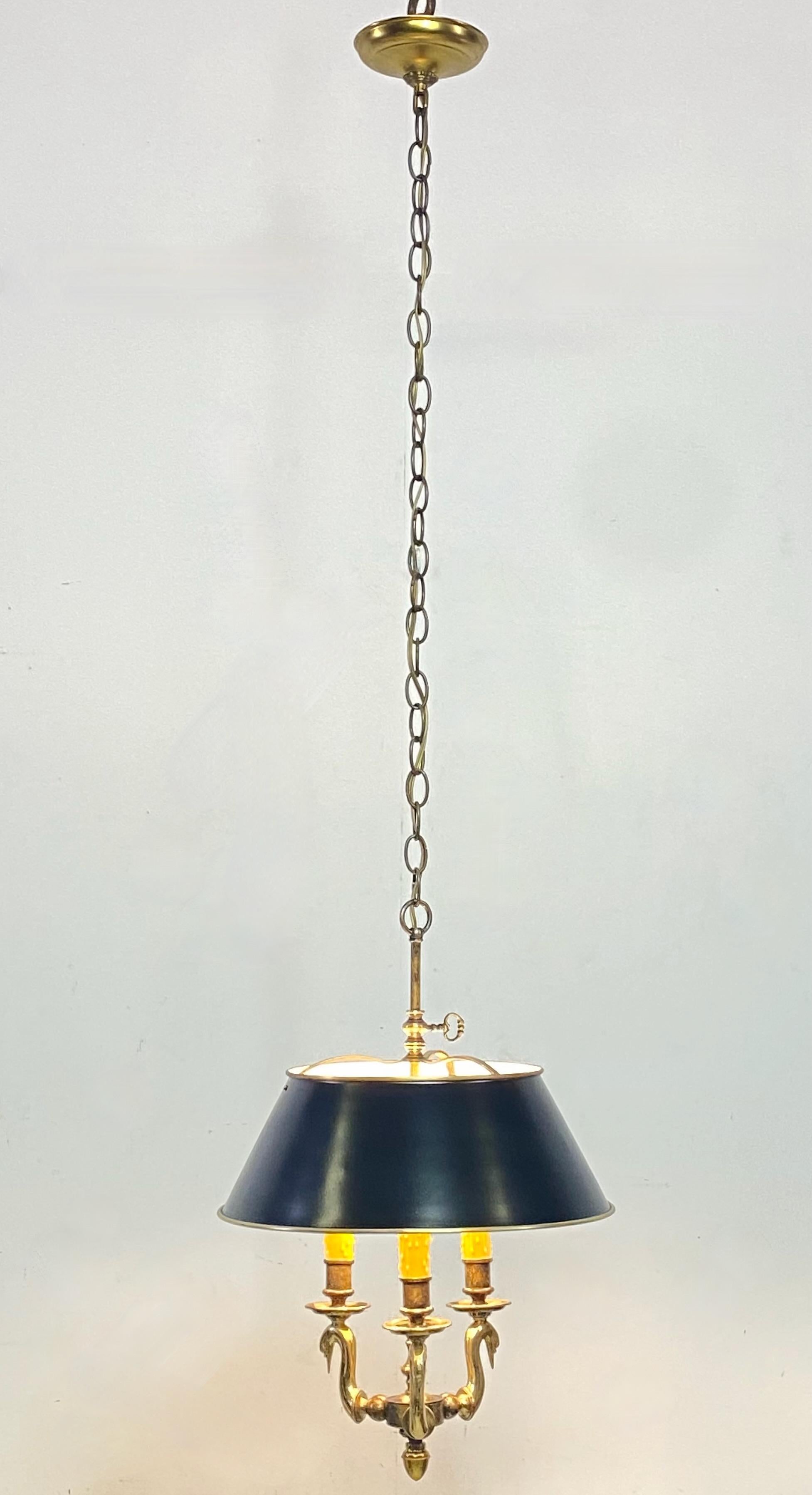 A solid brass bouillotte style hanging light fixture with black shade.
Re-wired and refurbished with new beeswax candle sleeves. Ready to install.
The measurement height of the lamp only is 15 inches. We can shorten the chain to buyers