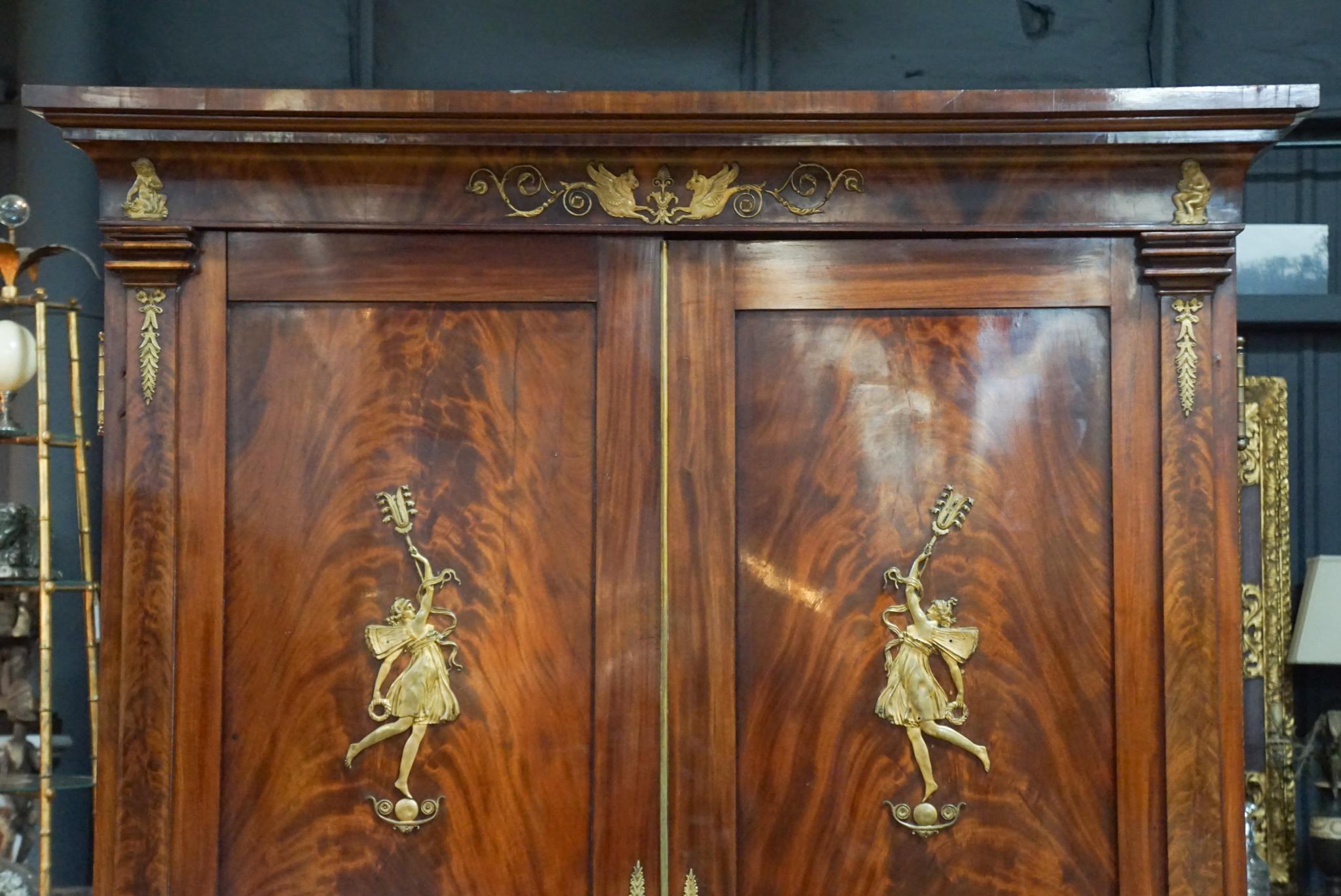This impressive and commanding wardrobe made in France at the end of the 19th century is almost certainly by Masion Krieger; While not stamped certain details are directly relatable to other stamped works by the firm. We have found two other large