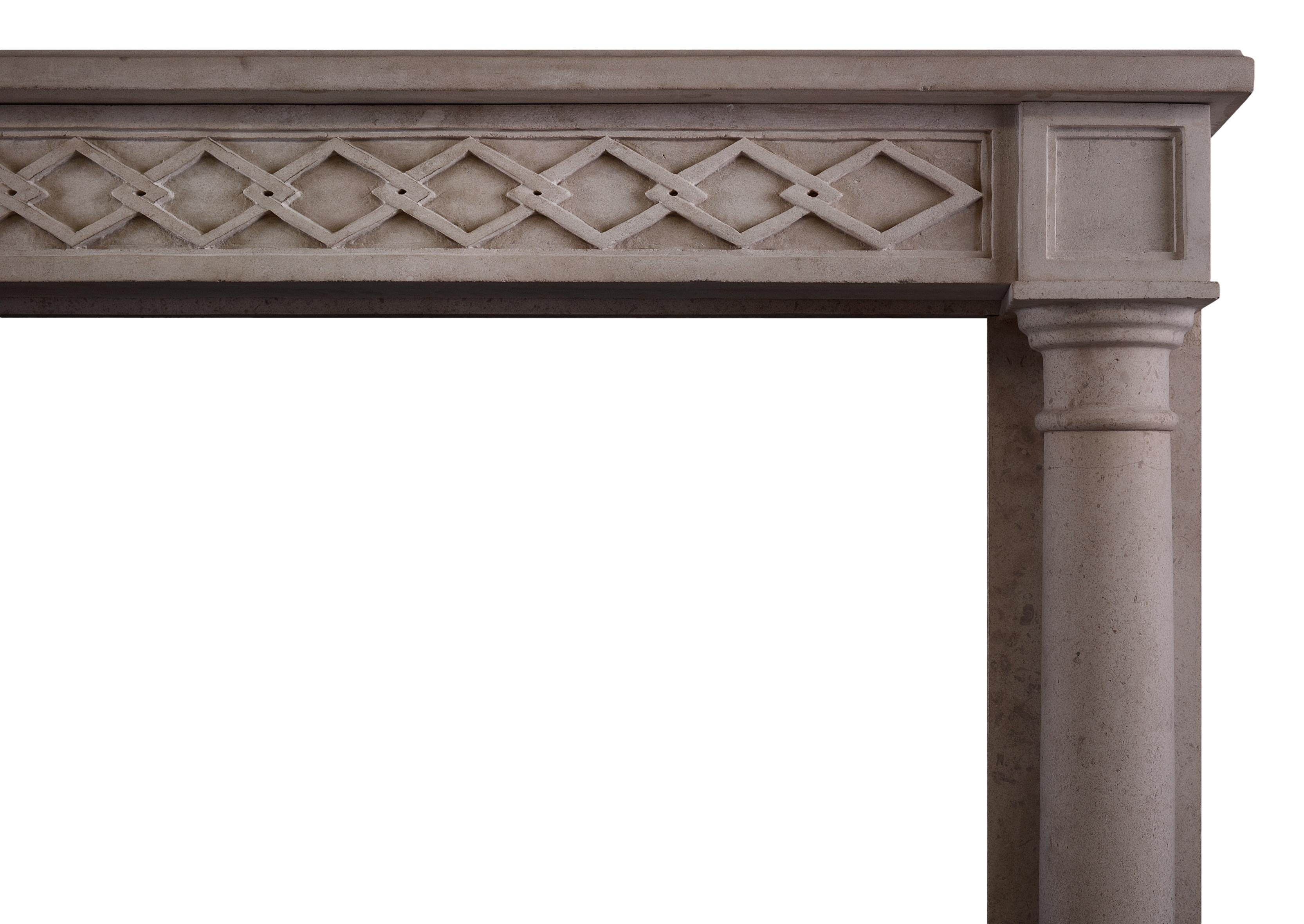 A French Empire style limestone fireplace. The frieze with interlocking diamond pattern with tapering, full round columns. A copy of an 18th century original.

Shelf width:           1460 mm /     57 ½ in
Overall height:      1090 mm /     42 7/8