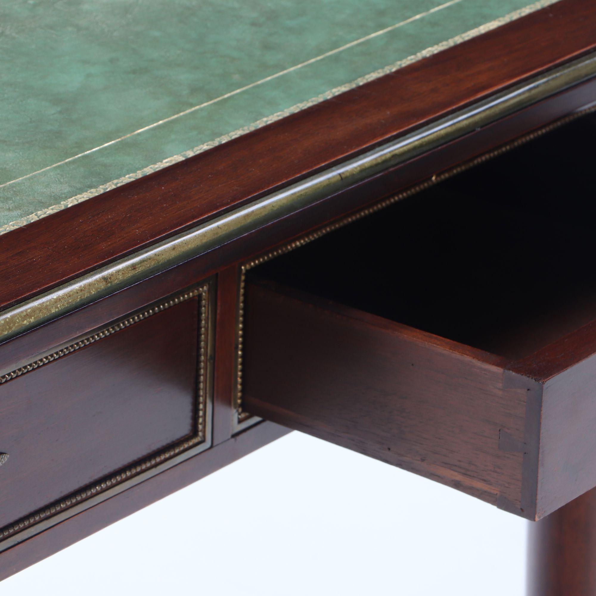Mid-20th Century French Empire style mahogany bronze mounted writing desk, leather top circa 1940 For Sale
