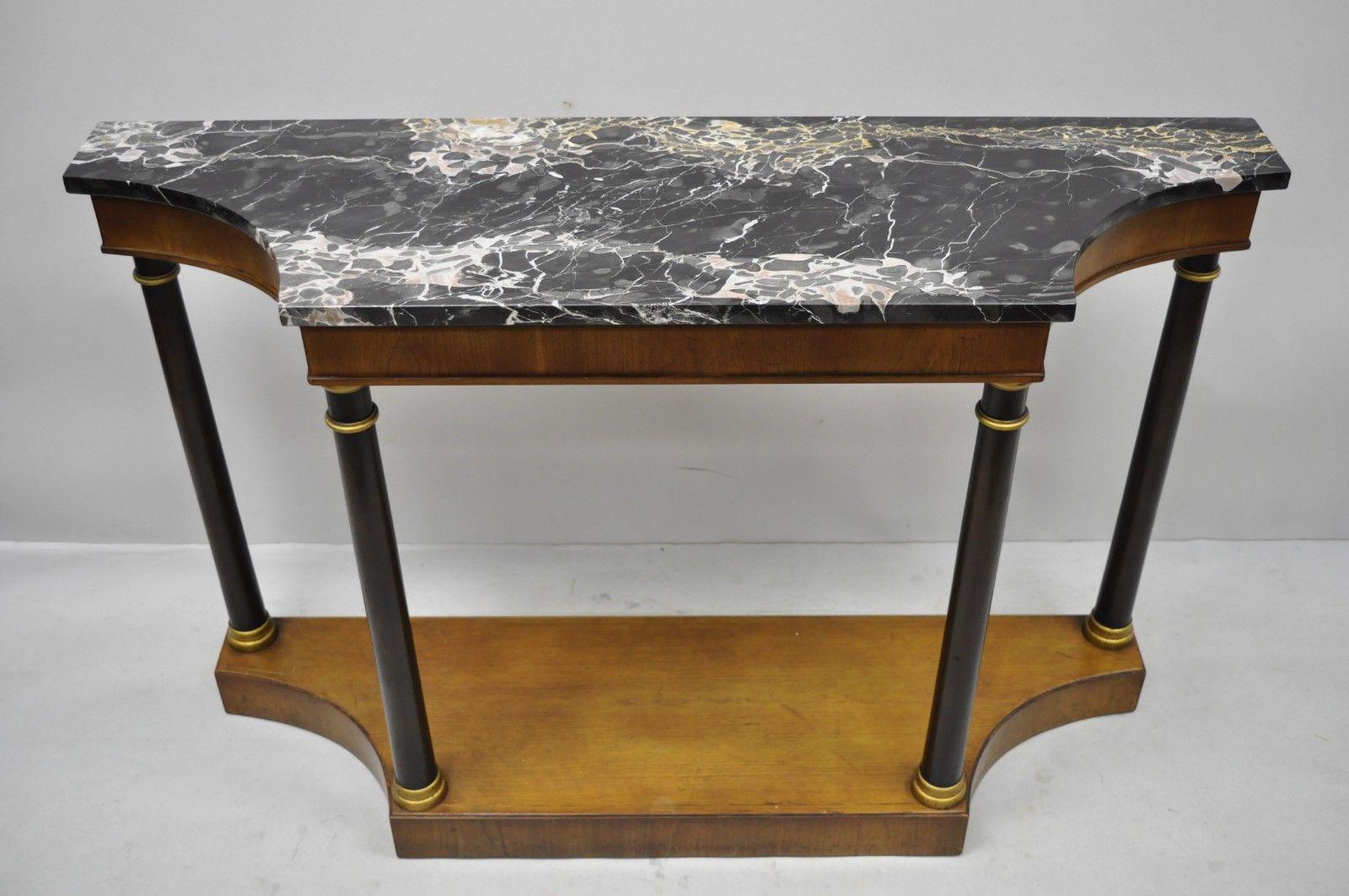 French Empire style marble-top console hall table with columns by Fine Arts Furniture. Item features shaped marble top, black and gold painted column supports, original tag, great style and form, circa early to mid-20th century. Measurements: 32