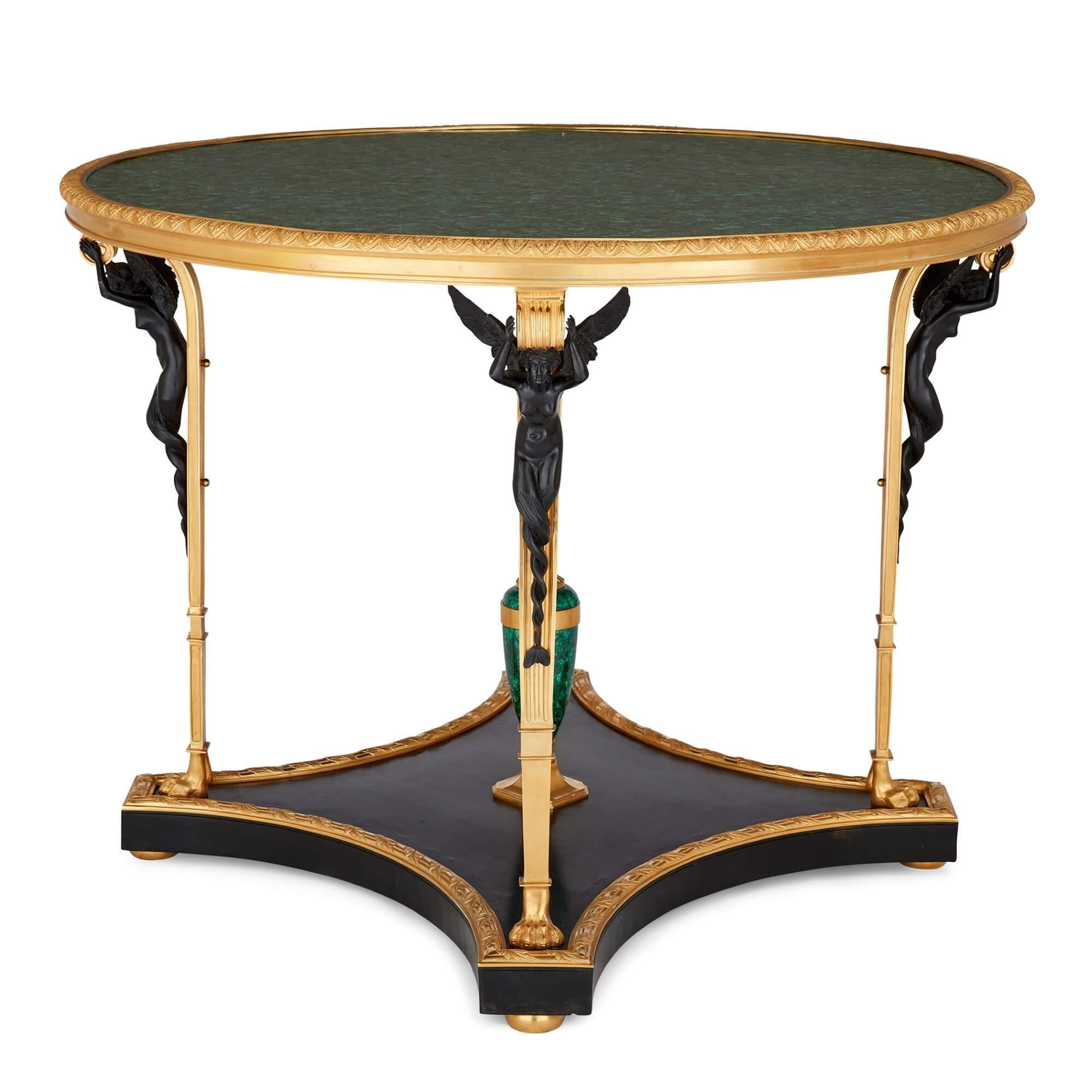 French Empire style ormolu mounted malachite centre table 
French, 20th Century
Height 77cm, diameter 100cm

Wonderfully crafted from a selection of high quality materials, this French Empire style centre table would make a stunning addition to an