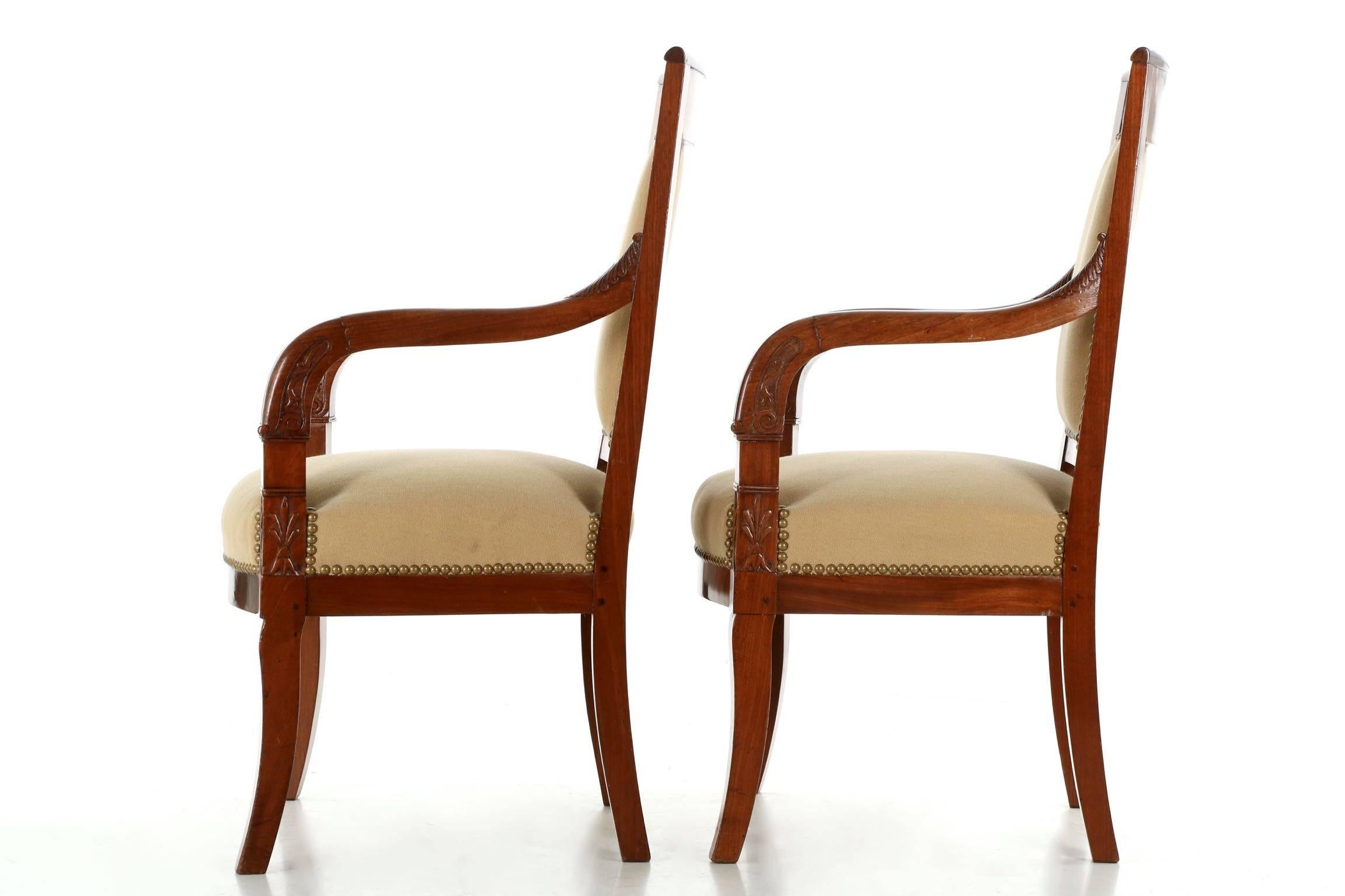 The deep ruby hues of the brilliant high polish mahogany primary woods on both chairs is just gorgeous. Designed clearly in the Empire taste, the pair is probably from the turn of the century while being crafted with earlier techniques - the seat