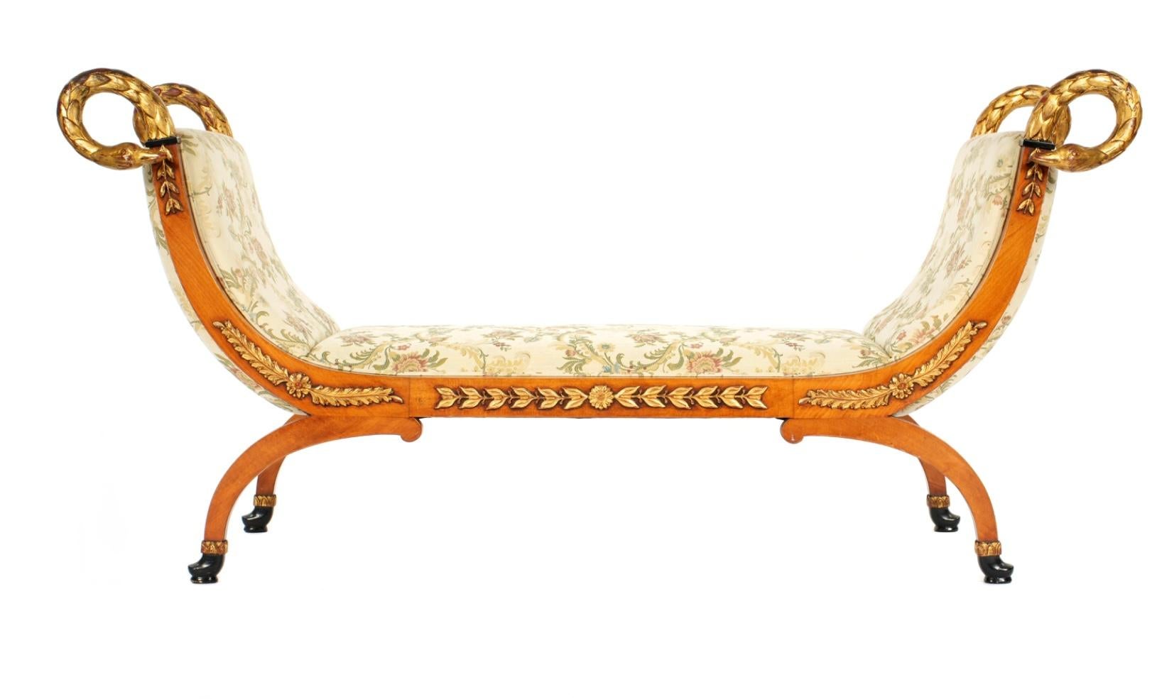 French Empire Style Parcel-Giltwood Recamier. This striking daybed features gracefully scrolling ends terminating in finely carved and gilded swan heads, a signature motif of the Empire aesthetic symbolizing beauty and fidelity. Frame is decorated