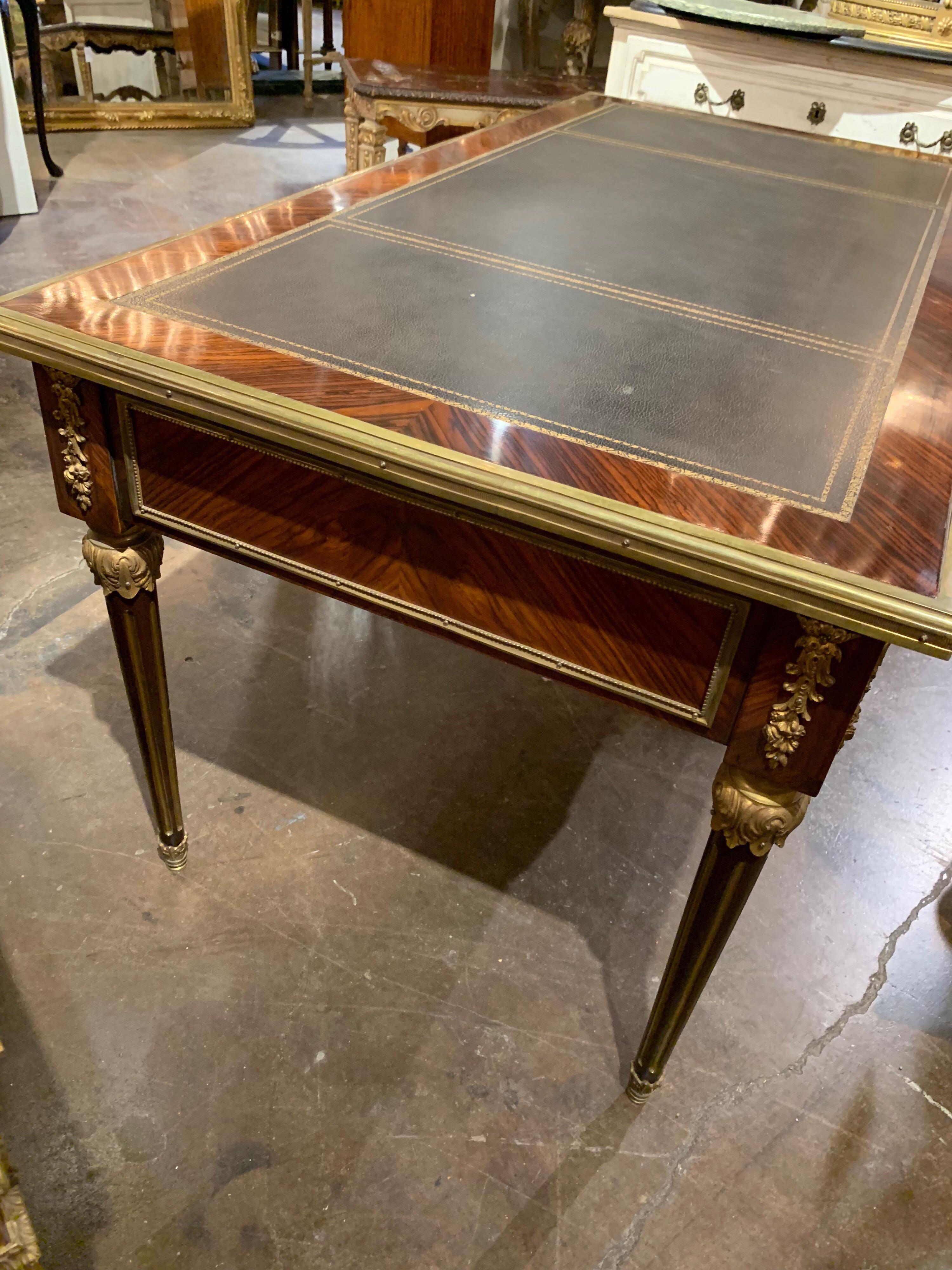 Very elegant French Empire style rosewood desk. Beautiful gilt bronze mounts and leather top. An impressive piece for a fine home.