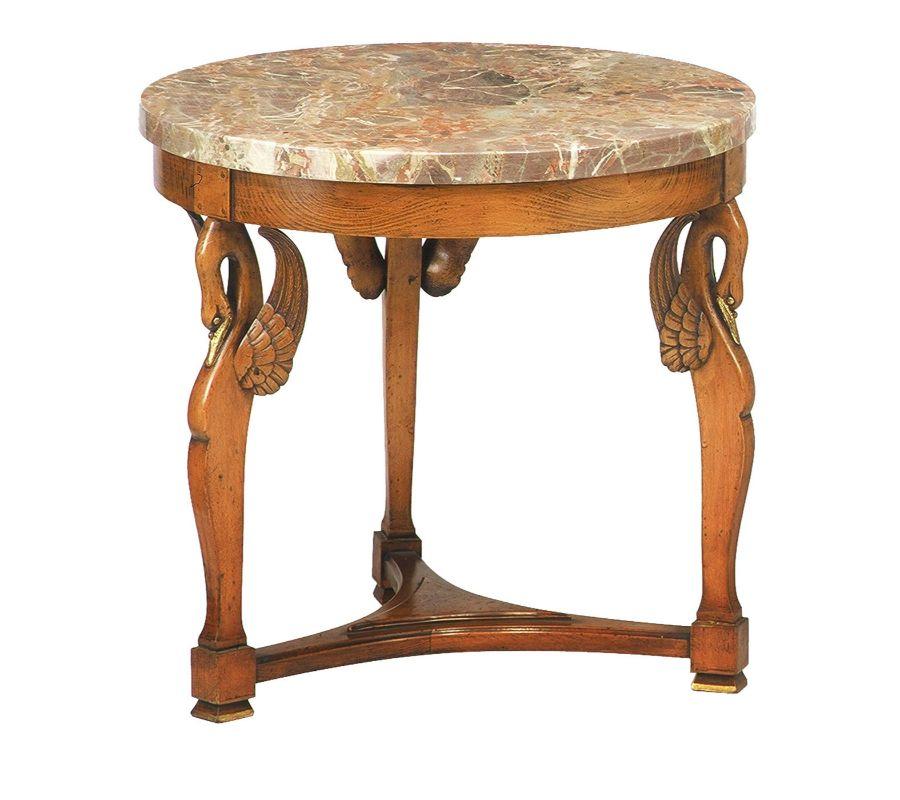 Swan-like legs joined by a triform stretcher are the eccentric elements, together with the circular, 3cm-thick top in prized Machiavecchia marble, making this accent table truly captivating. An impeccable reproduction of an original French Empire