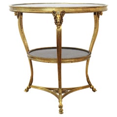 Table de Belier en bronze doré et marbre noir de style Empire à Gueridon