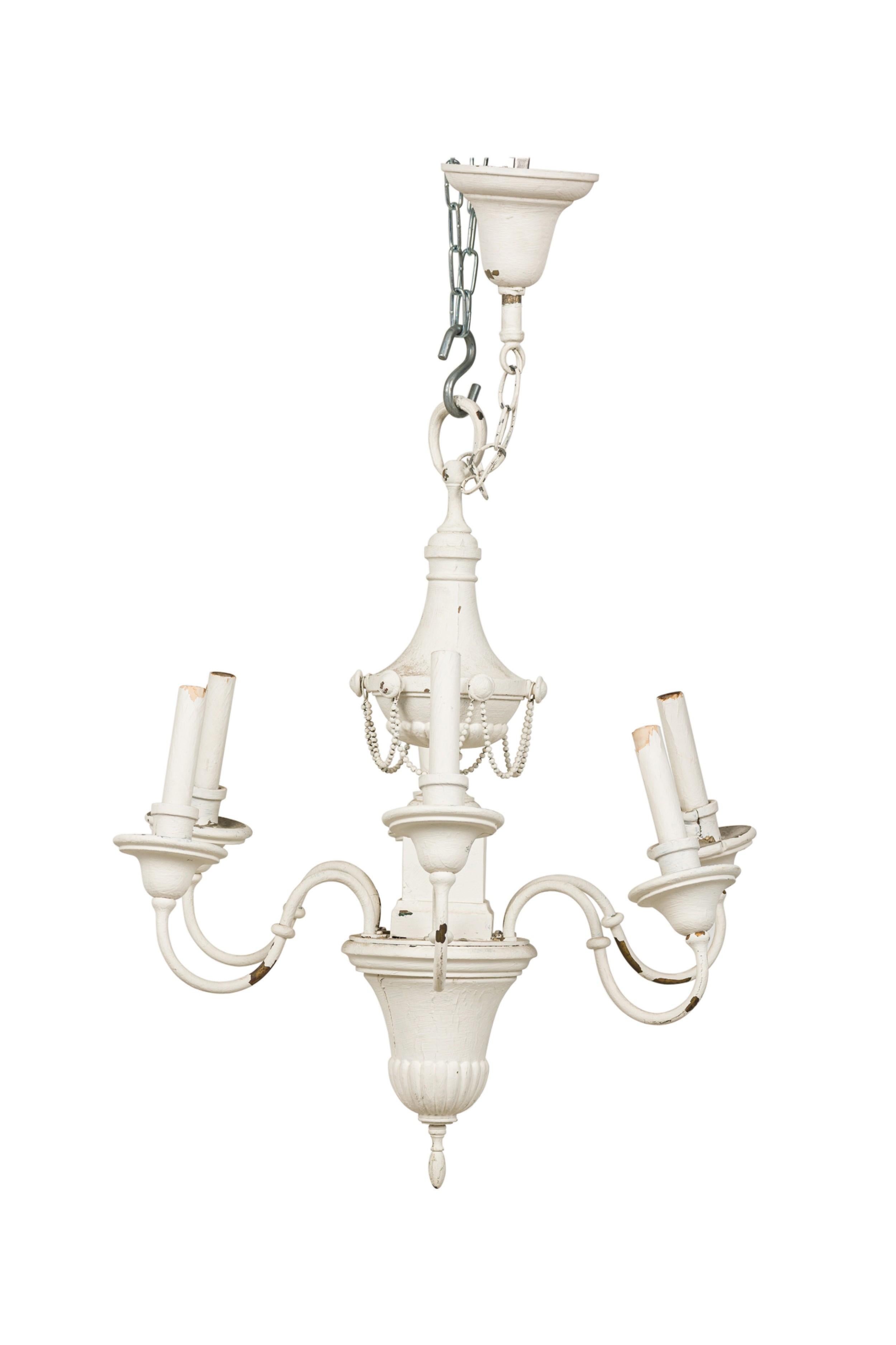 French Empire-Style (20th Century) distressed white painted tole 6-light chandelier featuring an elaborate urn form base with draped beads, branching out to 6 scroll candelabra.
 

 Distressed finish, needs rewiring.
