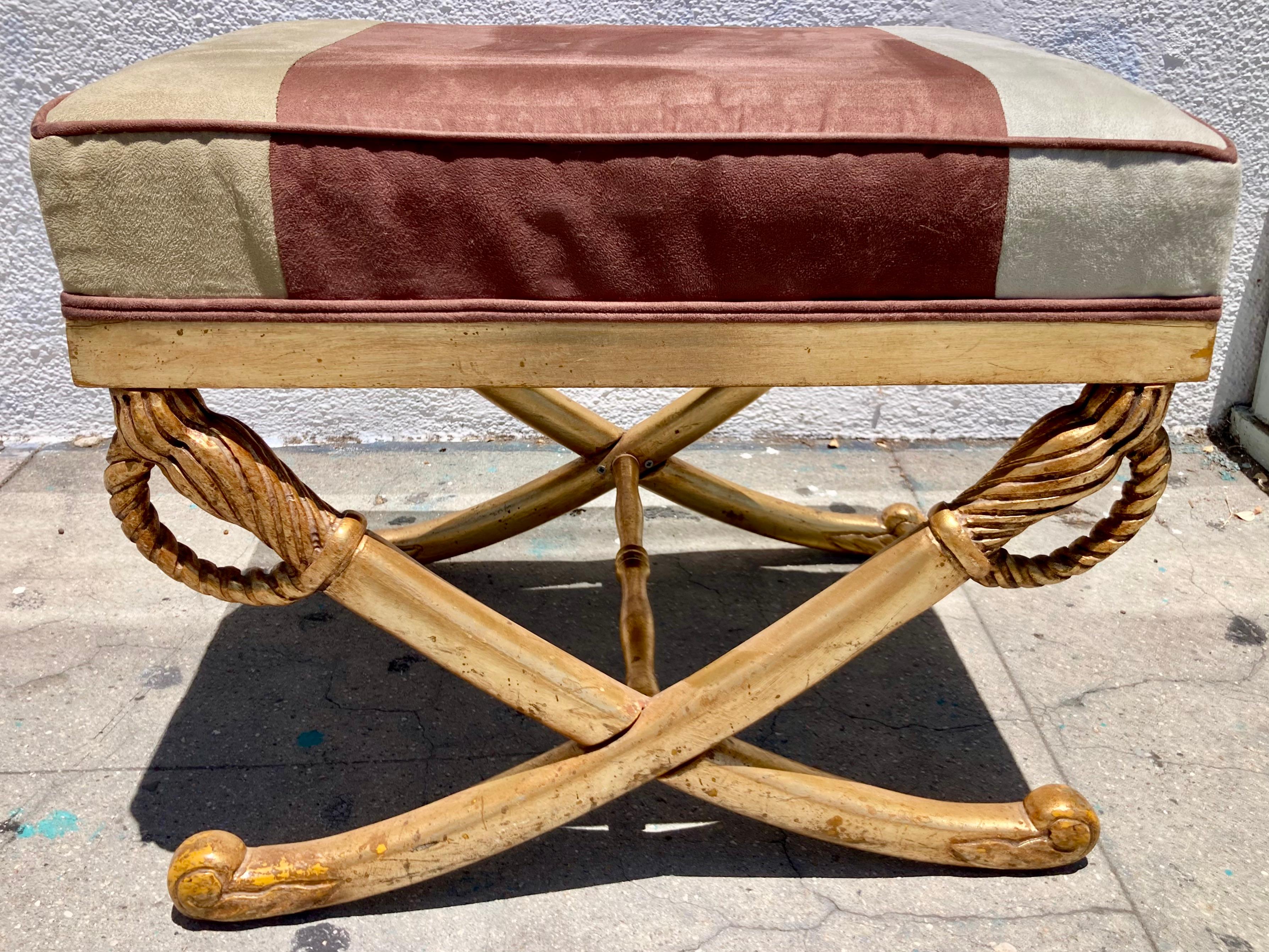 French gilt Empire sword bench with ultra sueded fabric. Beautiful carving details. Leave as is or have your upholstery shop recover and tighten frame.