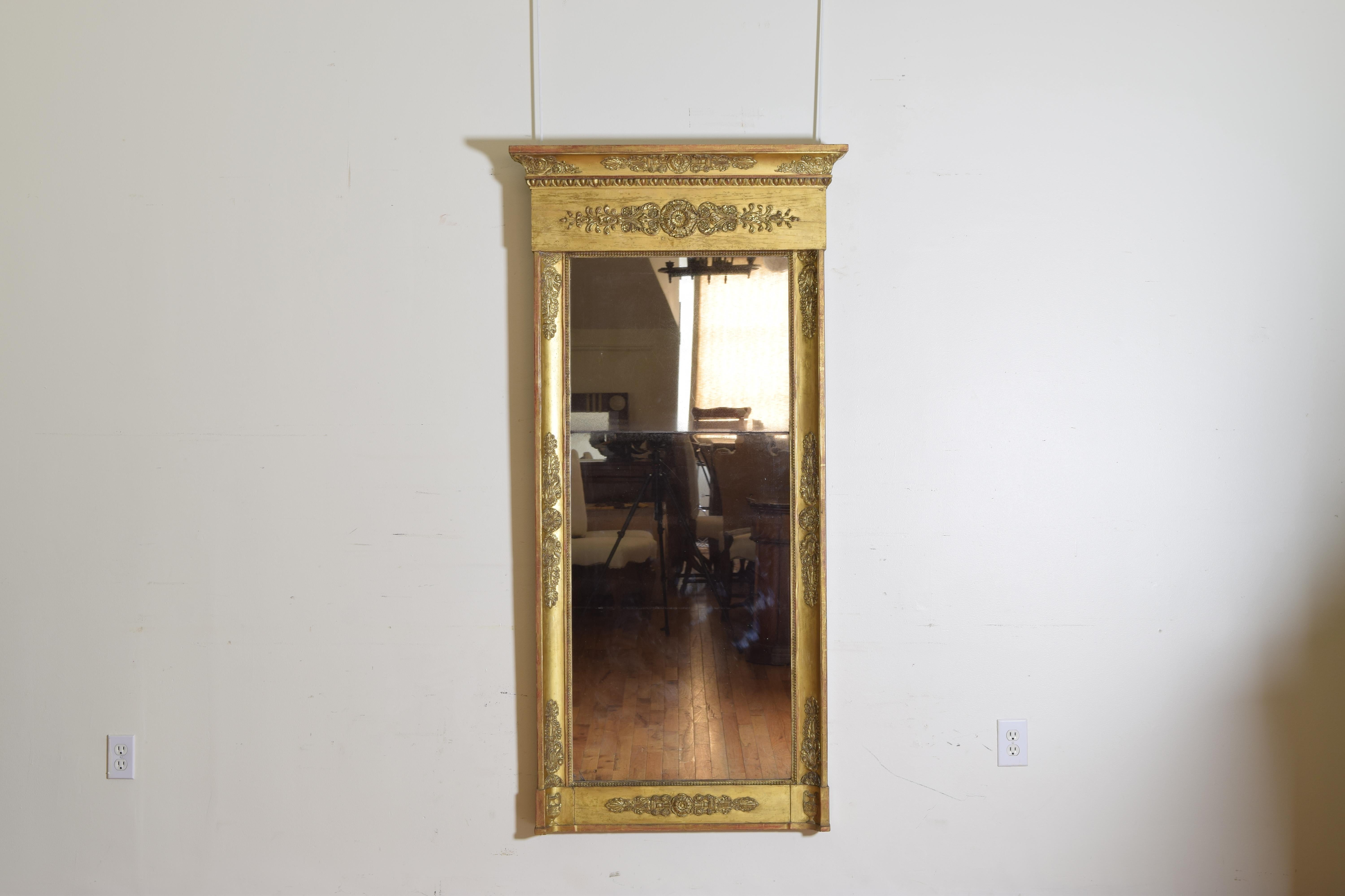 Having a flat bottom and sides and top with convex form, the surfaces all decorated with gilt-gesso decorations consisting of friezes of foliate scrolls, neoclassical rosettes, and egg and dart moldings, completely restored and in near perfect