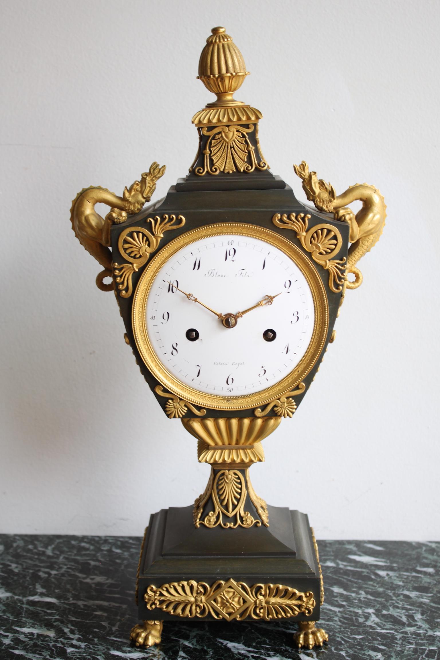 Gilt French Empire Urn Clock With His Globe For Sale