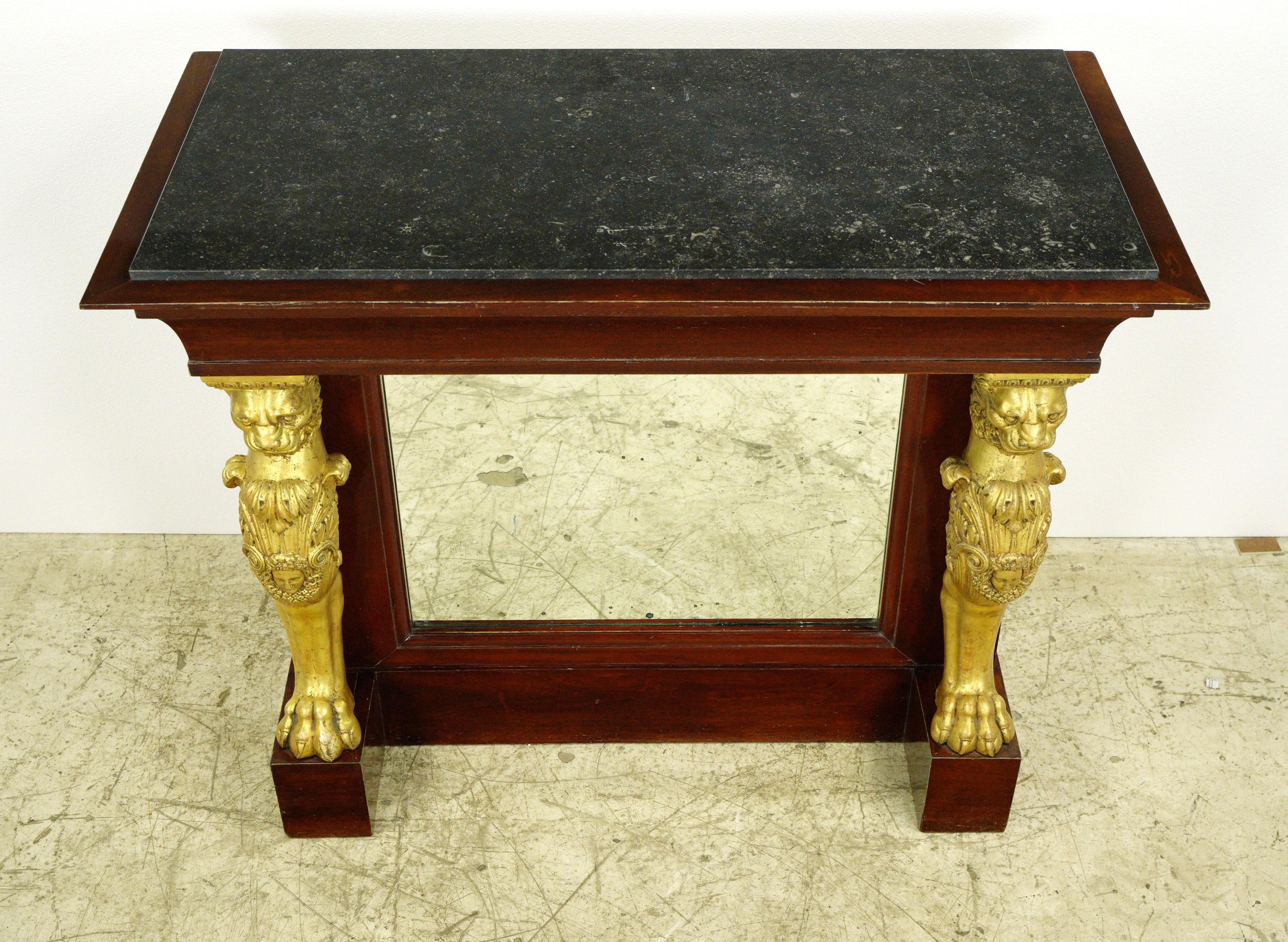 This piece was acquired from an estate located in Greenwich, Connecticut. French Empire mirrored front wood bar with black marble top. It features two drawers and storage shelves on the backside. Two keys are included. Good condition with