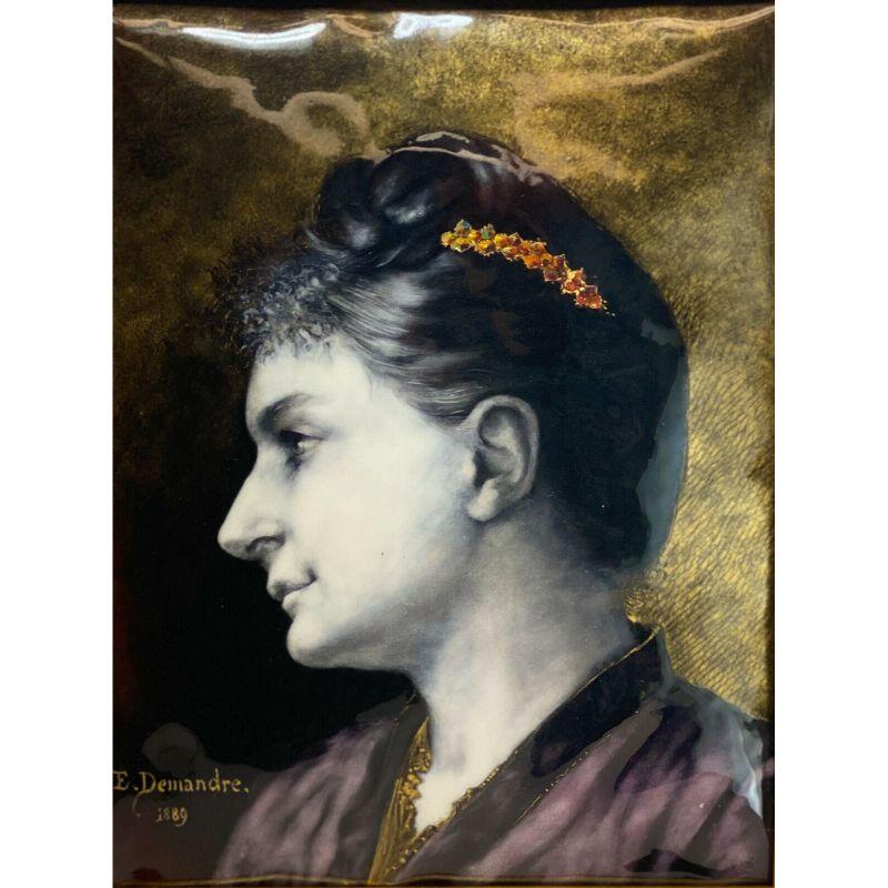 French Enamel Hand Painted Metal Plaque Beauty by E. Damandre, 1889

The plaque depicts a profile of a beauty with a jeweled pin in her hair. Artist signed 