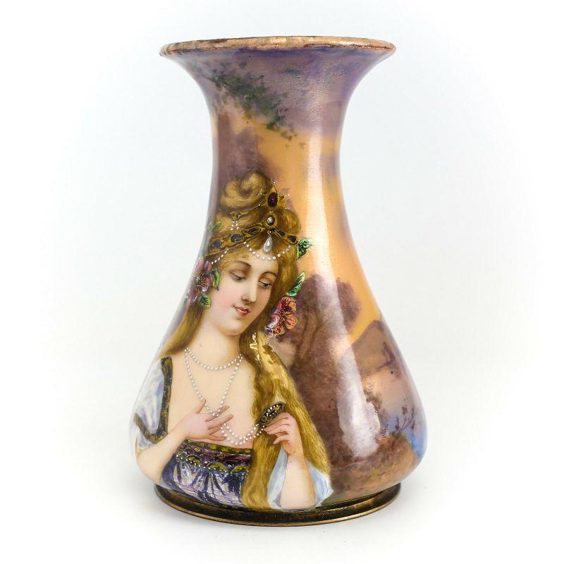 French Enamel on Metal Portrait Vase Hand Painted woman/landscape, Signed c1900

Beautiful Hand Painted Auburn Haired Woman w/ elaborate head piece & pearl necklace against a pastoral scene w/ Iridescent Accents. Signed 'Rig 3M'