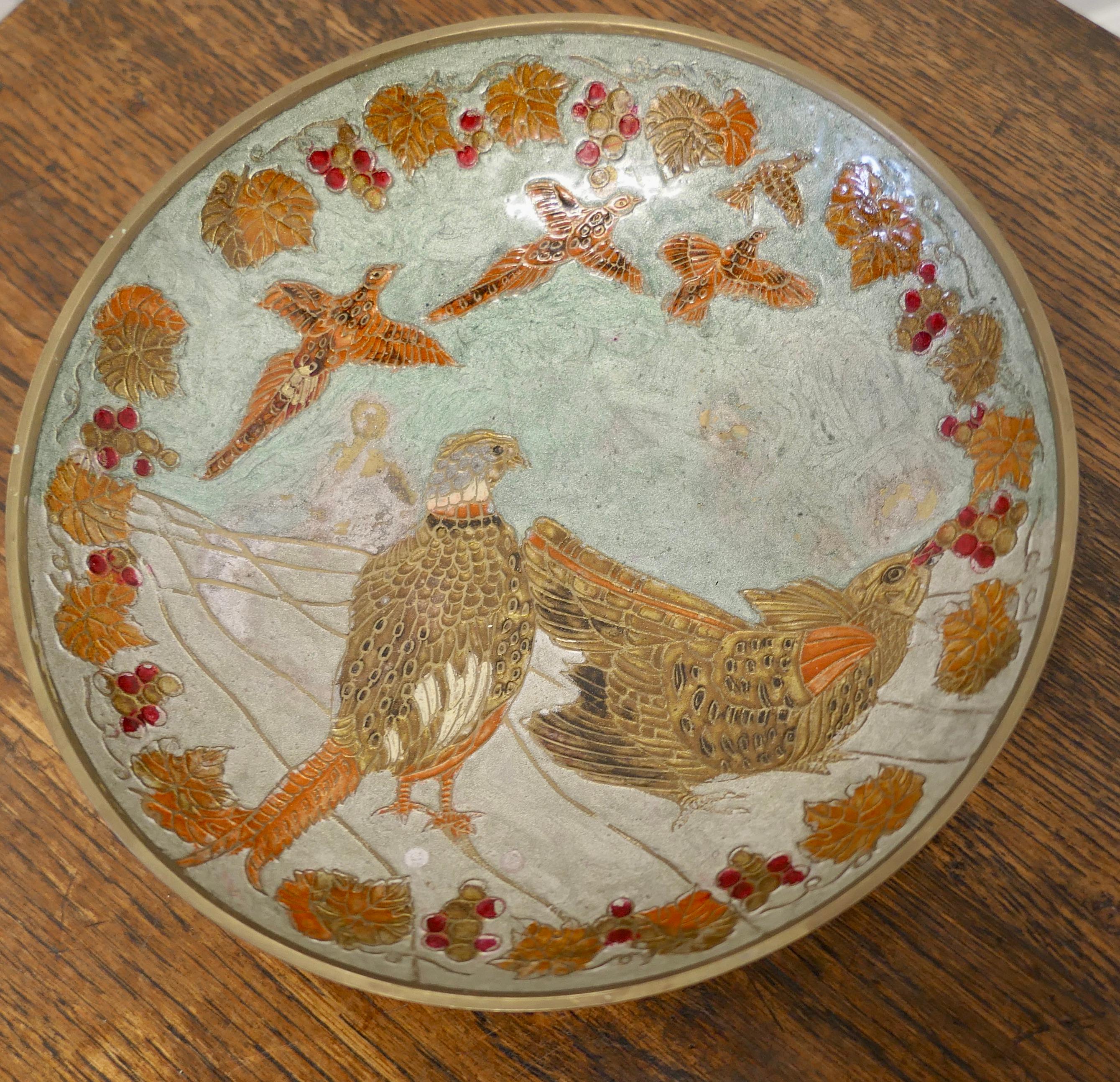 French Enamel Pheasants on brass bowl.

A very attractive piece with beautiful autumn colours on eggshell blue.
The bowl is in attractive used condition
It is 3” high and 9.5” in diameter. 
CC144.