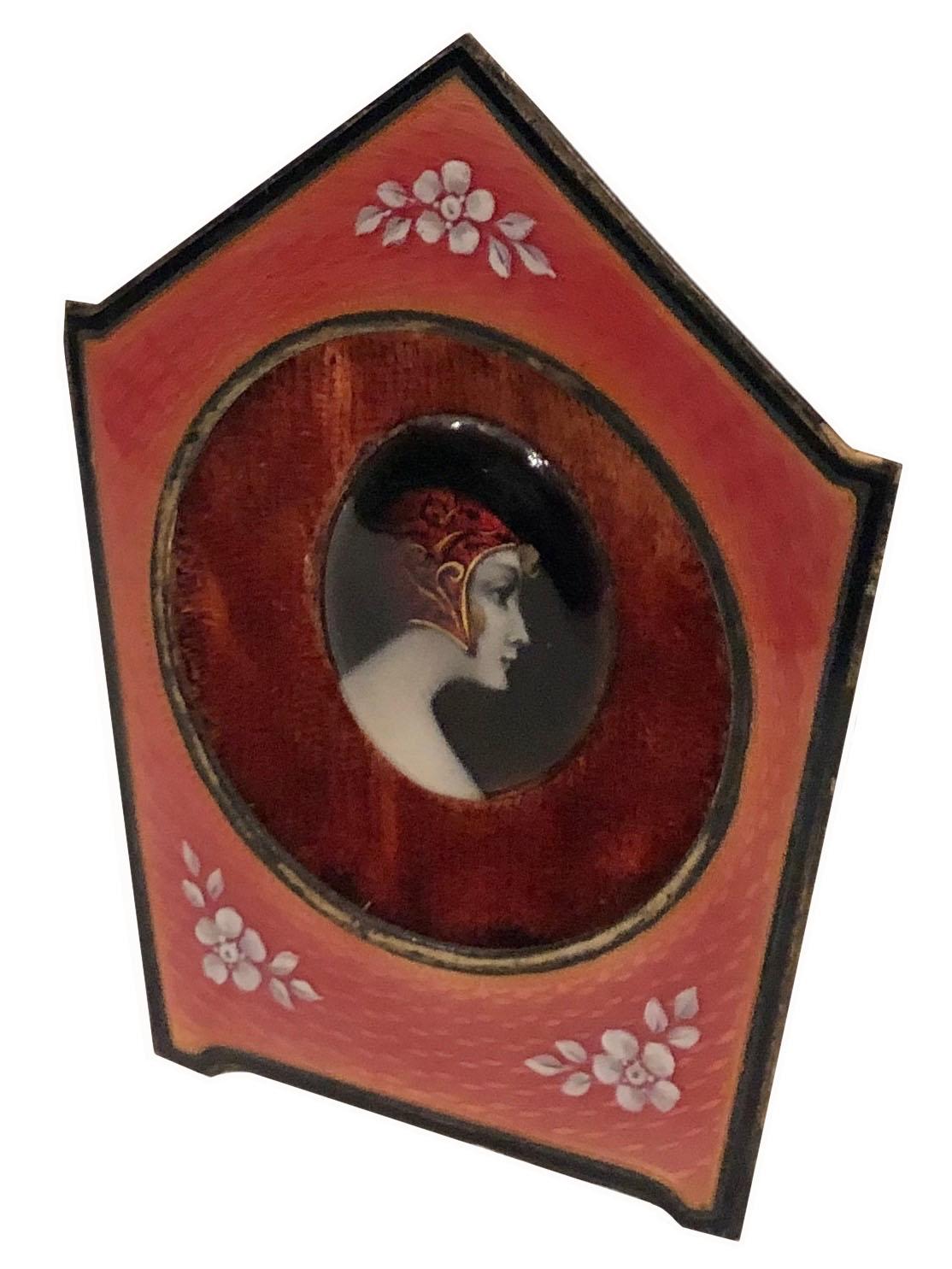 French enameled curiosity of a girl. Has a velvet liner around girl. It is on bronze or brass Guilloche. Back is lined in velvet it is in perfect condition. Early turn of the century.
 